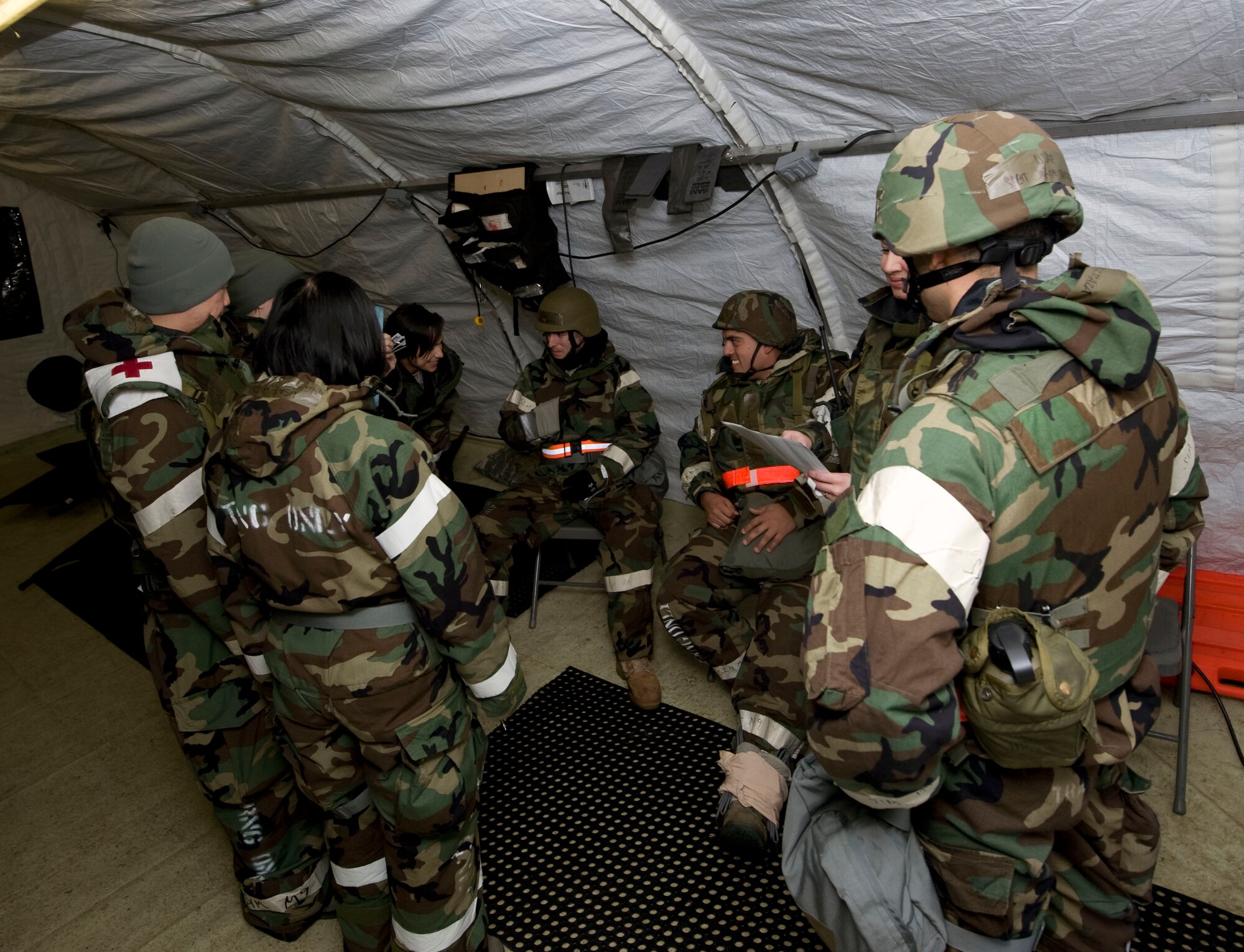 U.S. Air Force medics from the 35th Medical Group simulate triage during an operational readiness exercise at Misawa Air Base, Japan, Jan. 25, 2011. Misawa exercise evaluation teams tested the medics’ ability to properly evaluate incoming patients and prioritize care during contingency operations.  (U.S. Air Force photo by Tech. Sgt. Russell McBride/Released)