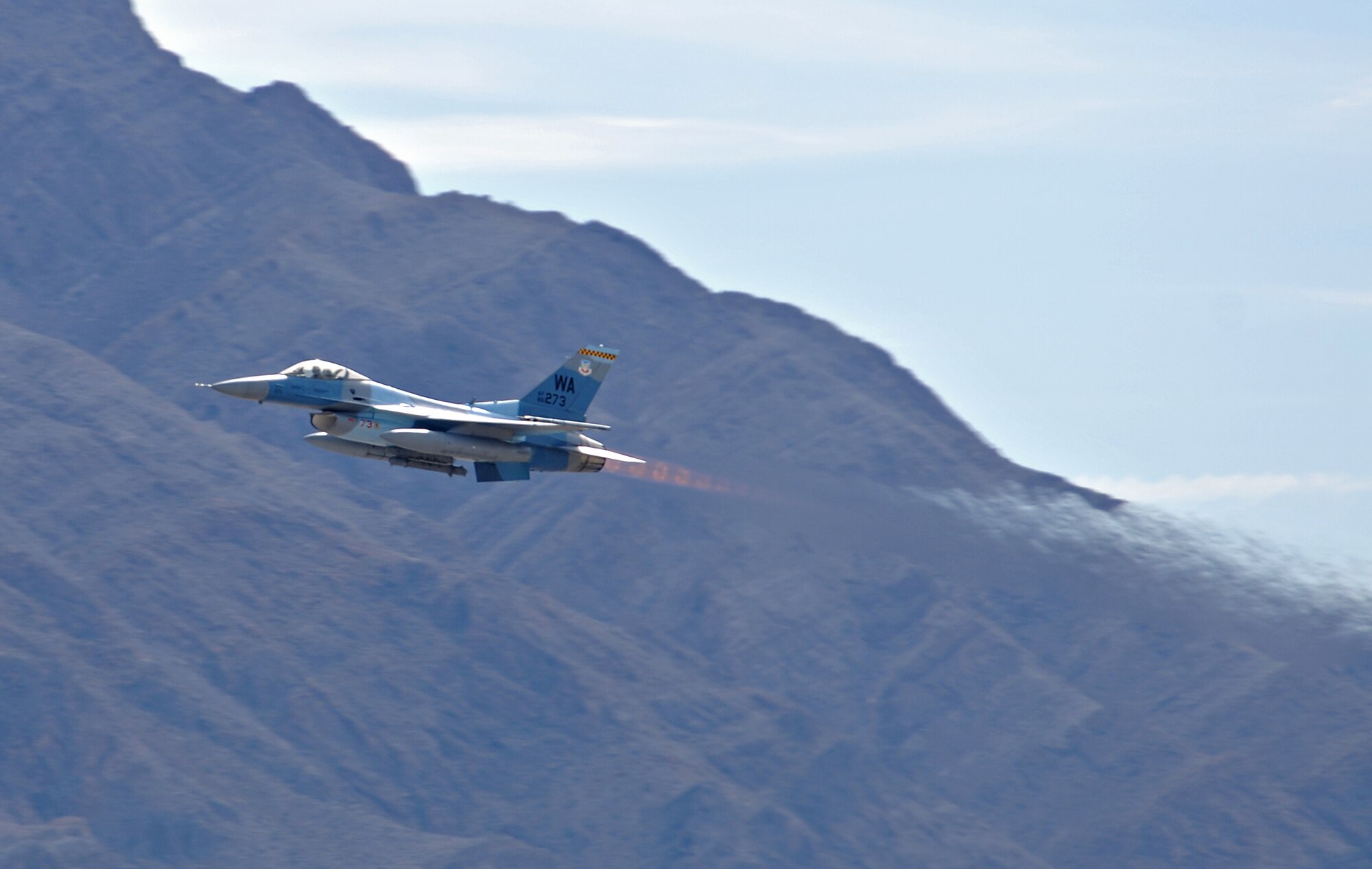 NELLIS AIR FORCE BASE, Nev. -- An F-16 Fighting Falcon from the 64th Aggressor Squadron, Nellis Air Force Base, Nev., takes off from the flightline during the first day of Red Flag 11-2 Jan. 24. Red Flag is a combined exercise that provides a realistic combat training environment to the U.S. and its allies. (U.S. Air Force photo/Staff Sgt. Benjamin Wilson)