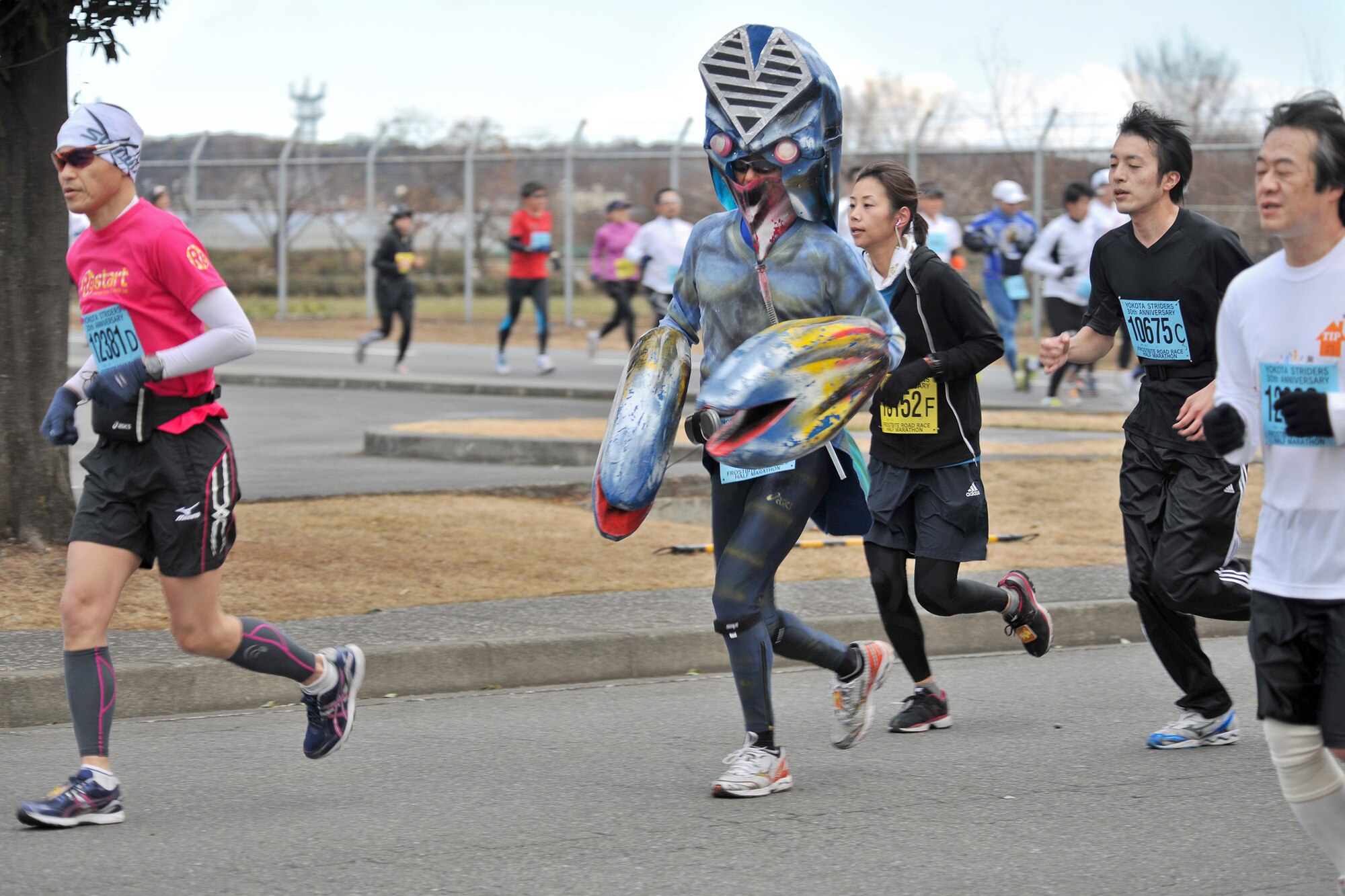 A runner dressed as a Japanese cartoon character participates in the 30th Annual Frostbite Road Race Jan. 16, 2011, at Yokota Air Base, Japan. Some of the 6,000 runners who participated chose to wear costumes, an act that has become a yearly tradition. (U.S. Air Force photo/Osakabe Yasuo)
