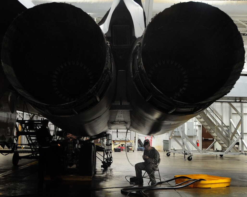 Airman 1st Class Zachery Brackeen, 28th Aircraft Maintenance Squadron crew chief, services the Cn2 hydraulic system on the B-1B Lancer engine at Ellsworth Air Force Base, S.D., Jan. 21.  The Cn2 system runs all of the hydraulics on the aircraft and is maintained and refilled as needed to ensure the proper flow of fluids. (U.S. Air Force photo/Senior Airman Anthony Sanchelli)