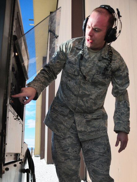 Staff Sgt. Chris Dieball, 28th Aircraft Maintenance Squadron crew chief instructor, turns on a diesel generator at Ellsworth Air Force Base, S.D., Jan. 21.  When Airmen conduct maintenance on the B-1B Lancer, it is hooked up to and runs off a generator. (U.S. Air Force photo/Senior Airman Anthony Sanchelli)