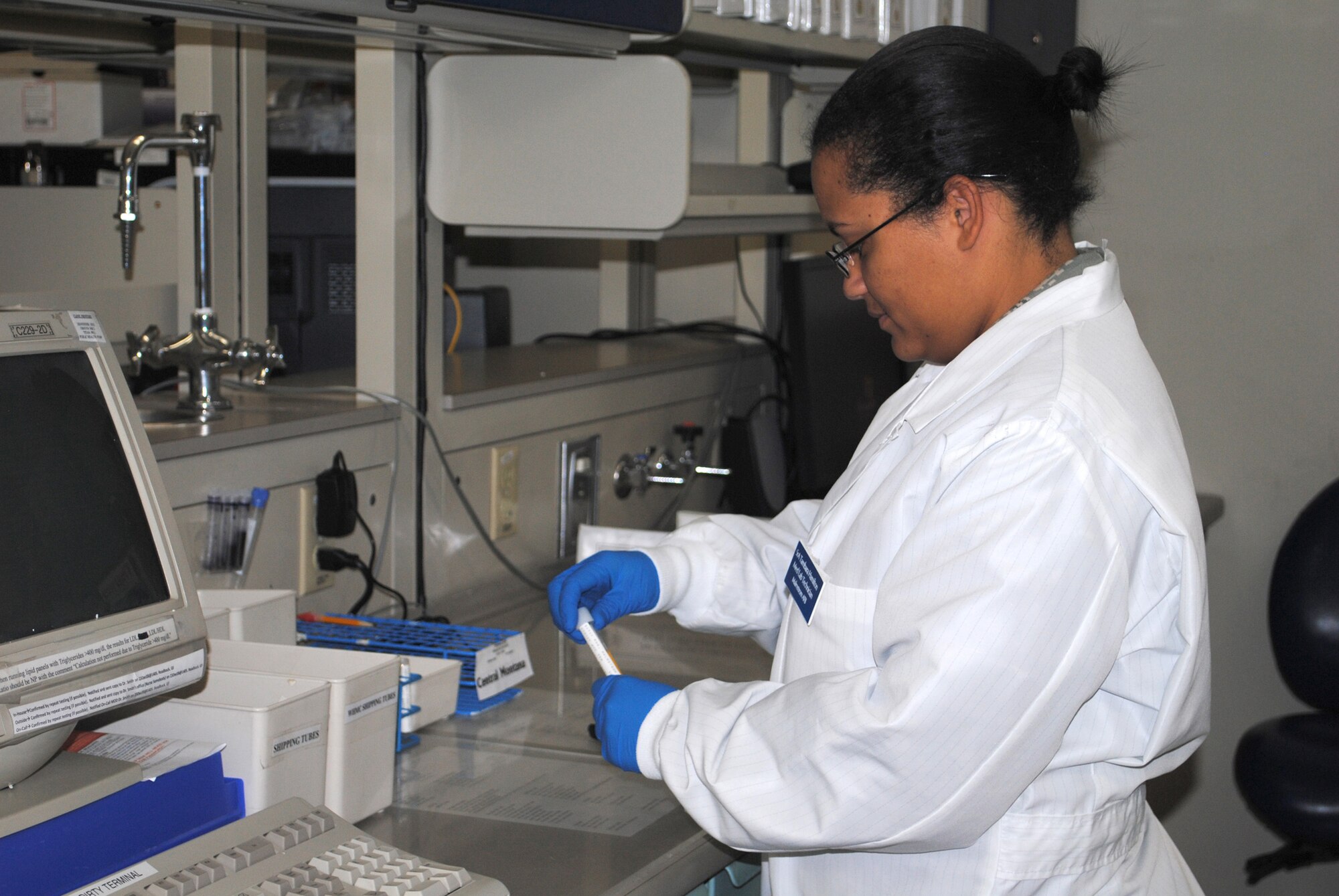 Senior Airman Tambara Hamilton, a 341st Medical Support Squadron lab technician, tests blood samples from a patient.  When she's not at work, Airman Hamilton enjoys spending time with her twin sister. (U.S. Air Force photo/Airman Cortney Hansen)