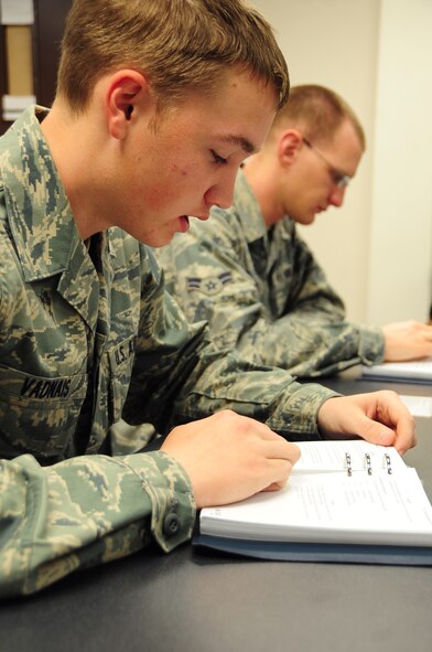 (Left to right) Airman Mark Vadnais and Airman 1st Class Christian Mains, 28th Aircraft Maintenance Squadron able chiefs, study a B-1B Lancer technical order at Ellsworth Air Force Base, S.D., Jan. 21.  B-1 crew chief Airmen must attend 22 academic days, consisting of 108 hours of training, before becoming a true crew chief. (U.S. Air Force photo/Senior Airman Anthony Sanchelli)