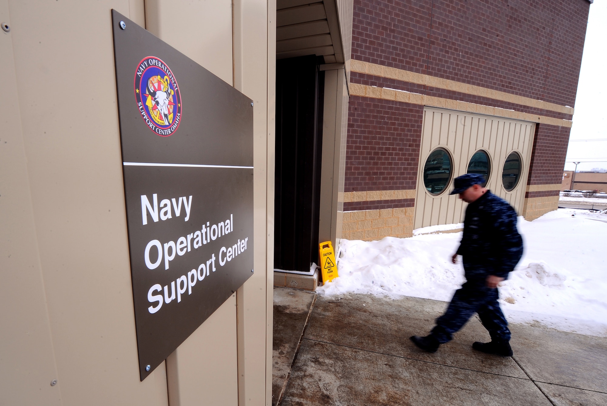 OFFUTT AIR FORCE BASE, Neb. -- A Sailor walks into the newly constructed Navy Operational Support Center Omaha here, Jan. 22. The new $4.3 million facility boasts 19,000 square feet after spending 45 years in an outdated facility in North Omaha.
U.S. Air Force Photo by Josh Plueger
(released)
