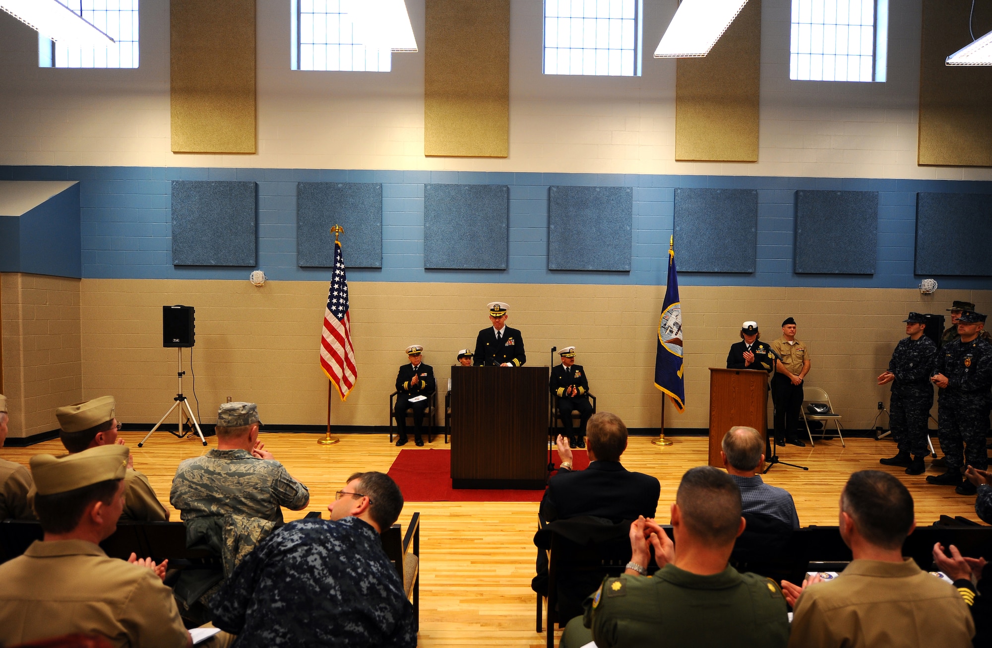OFFUTT AIR FORCE BASE, Neb. ? Commander Lanny G. Johnston, commanding officer of the Naval Operational Support Center, Omaha, provides opening remarks in the newly constructed NOSC  for the ceremonial ribbon cutting ceremony located here, Jan. 22.  The 19,000-square foot, $4.3 million NOSC is now located behind Offutt's gates from its previous location in North Omaha, were it has been since 1965. U.S. Air Force Photo by Josh Plueger (released)