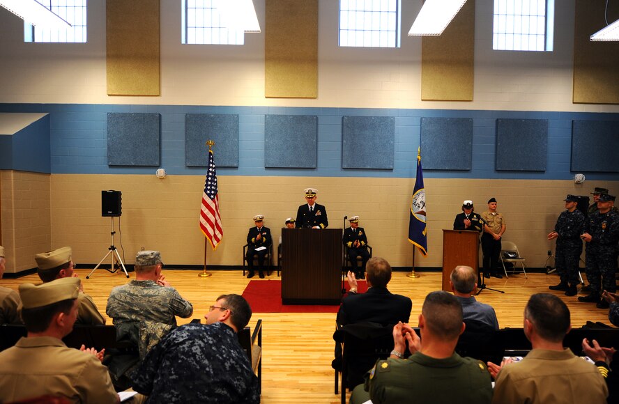 OFFUTT AIR FORCE BASE, Neb. ? Commander Lanny G. Johnston, commanding officer of the Naval Operational Support Center, Omaha, provides opening remarks in the newly constructed NOSC  for the ceremonial ribbon cutting ceremony located here, Jan. 22.  The 19,000-square foot, $4.3 million NOSC is now located behind Offutt's gates from its previous location in North Omaha, were it has been since 1965. U.S. Air Force Photo by Josh Plueger (released)