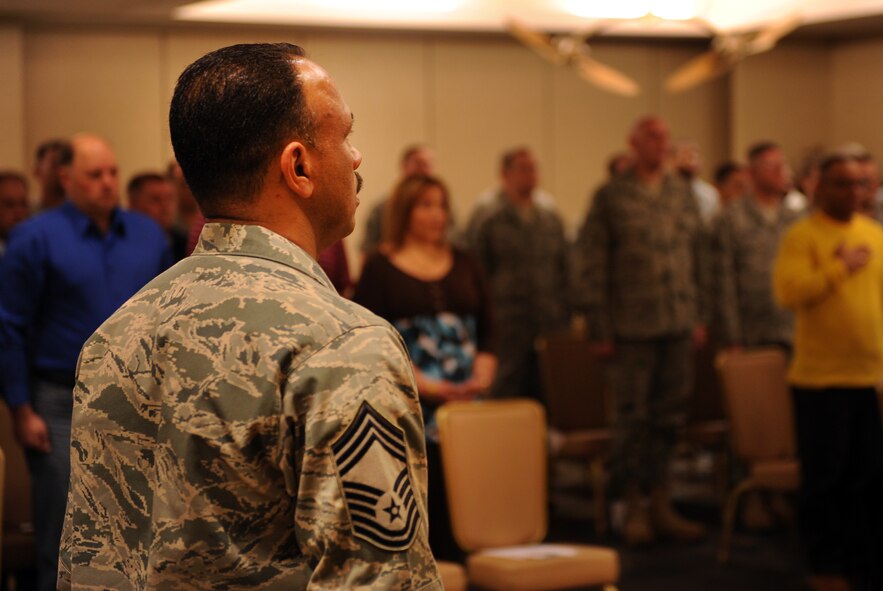 MOODY AIR FORCE BASE, Ga. -- Chief Master Sgt. Alejandro DePass, 723rd Aircraft Maintenance Squadron superintendent, stands at attention during the singing of the National Anthem Jan. 25. As of May, Chief DePass will officially be retired serving 30 years 8 days. (U.S. Air Force photo/Airman 1st Class Douglas Ellis)(RELEASED)