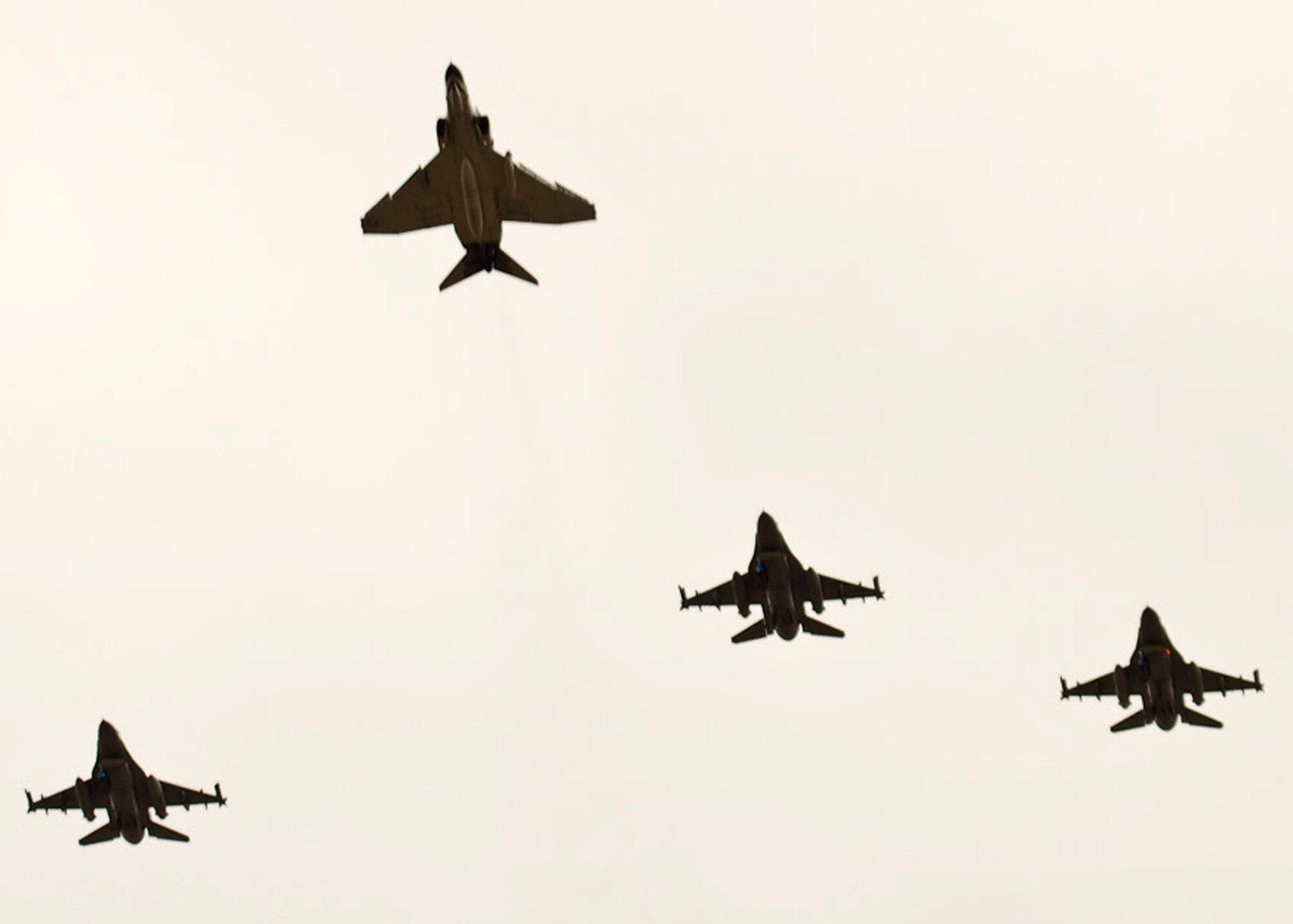An F-4 from Detachment 1, 82nd Aerial Targets Squadron at Holloman Air Force Base, N.M., leads the way during a flyover for a memorial service Jan. 14 at Dallas-Fort Worth National Cemetery. The service honored Col. James E. Dennany and Maj. Robert L. Tucci, who were reported missing in action after their F-4 went down during a mission over Laos Nov. 12, 1969.  (Courtesy photo)