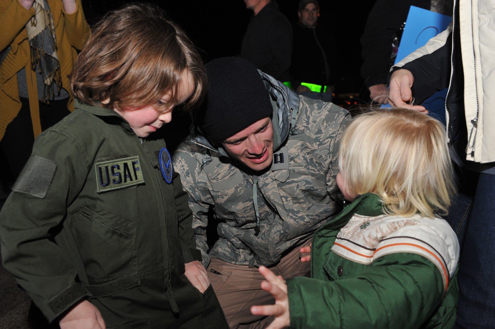 Capt. Paul Tandberg, 61st Airlift Squadron navigator, greets his sons Boyd, 4; and Tate, 1; after returning from his deployment Jan. 22, 2011, at Little Rock Air Force Base, Ark. The Airmen returned from deployment after spending more than 155 days in Ali Al Salem Air Base, Kuwait. (U.S. Air Force photo by Senior Airman Gul Crockett)