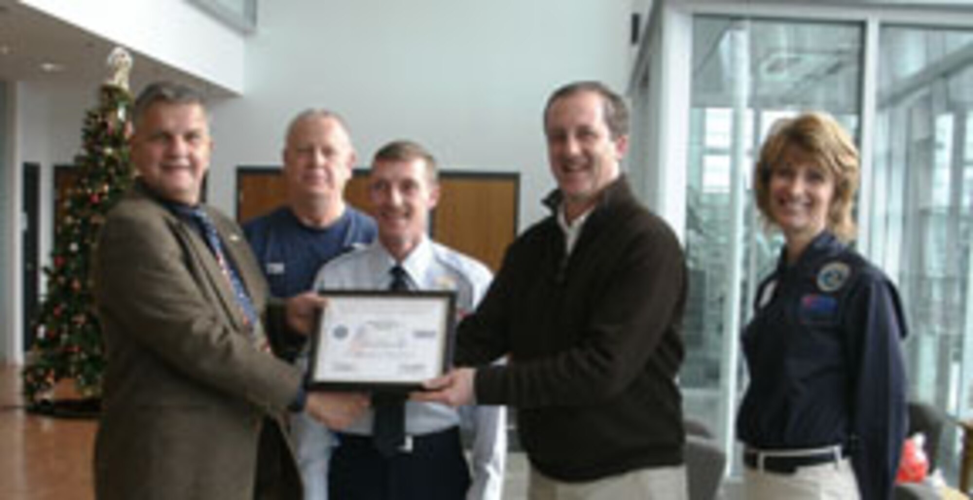 Bill Hines Jr., Co-Managing Director of Interprint, is present with the Patriot Award on behalf of Mr. Roland Morin.
Photo Left to Right: Earl Bonett, Tom Cornellier, Sr., MSgt Scott Trumble, Bill Hines, Jr., and Diane Swain. (ESGR courtesy photo)
