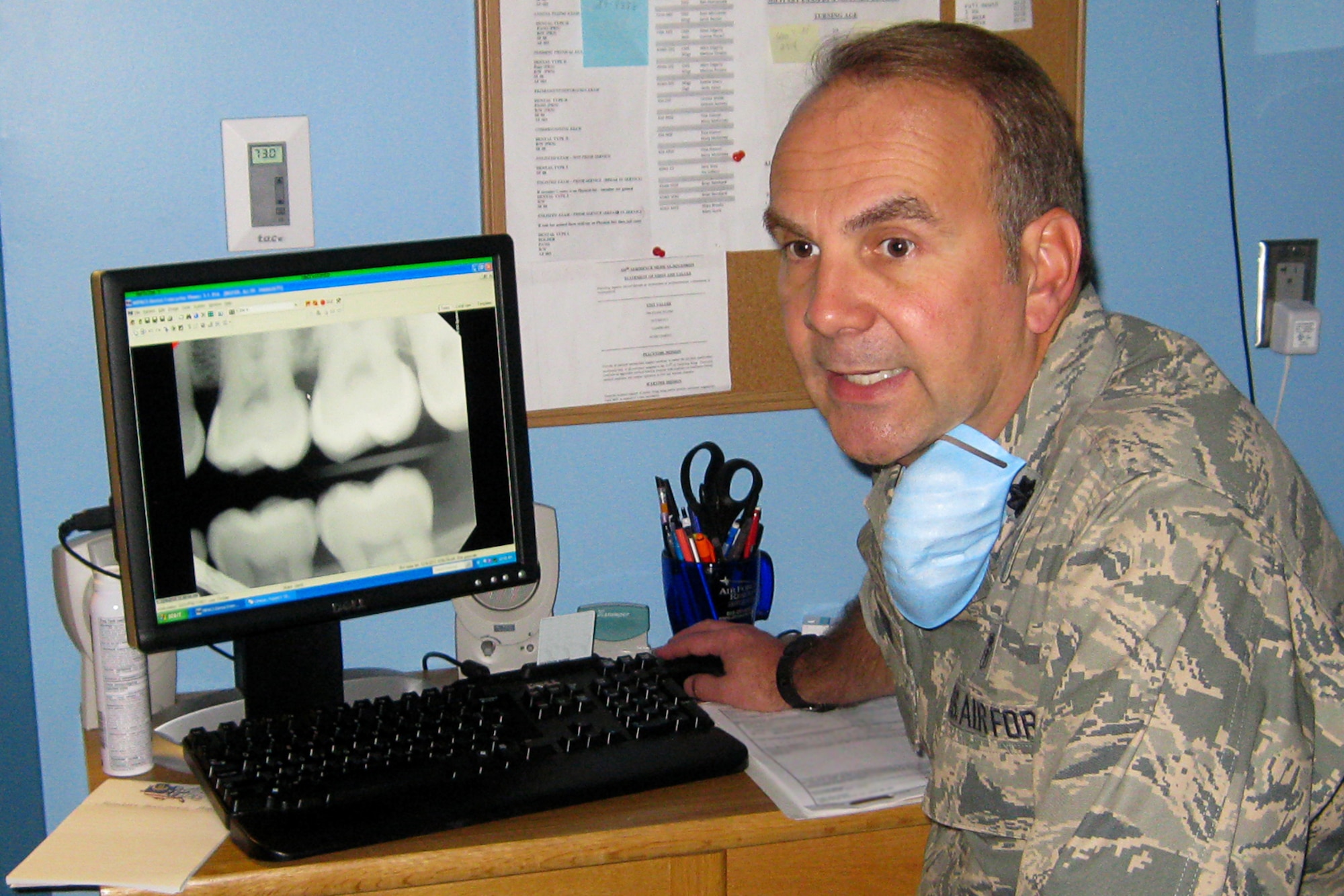 GRISSOM AIR RESERVE BASE, Ind. -- Lt. Col. (Dr.) Todd Martin explains the condition of his patient's teeth after reviewing x-rays here recently. Colonel Martin is one of three new dentists assigned to the 434th Aerospace Medicine Squadron. (U.S. Air Force photo illustration/Capt. Kelly Howard)                               
                         