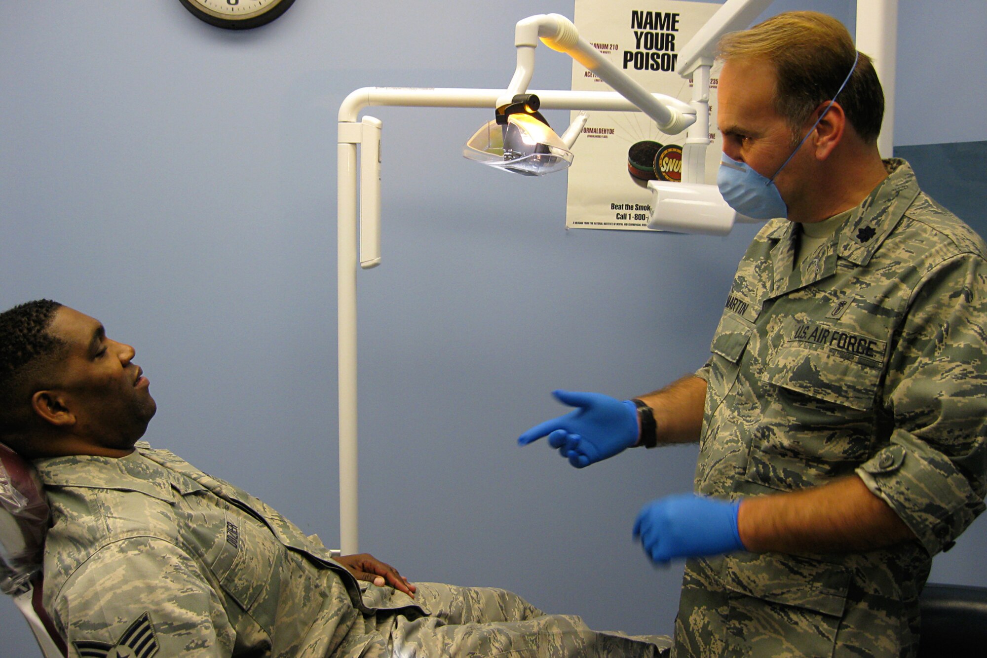 GRISSOM AIR RESERVE BASE, Ind. -- Lt. Col. (Dr.) Todd Martin talks with Staff Sgt. Allen Dozier during his dental examination here recently. Colonel Martin is one of three new dentists assigned to the 434th Aerospace Medicine Squadron. Sergeant Dozier is a fire team member with the 434th Security Forces Squadron. (U.S. Air Force photo illustration/Capt. Kelly Howard)                               
                        