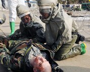 KUNSAN AIR BASE, Republic of Korea -- Airmen from the 8th Medical Group work together to prepare a patient for transport to the decontamination point here Jan. 25 during the peninsula-wide exercise Beverly Bulldog 11-01. Wolf Pack Airmen are currently participating in the exercise to prepare for the 8th Fighter Wing's Operational Readiness Inspection. (U.S. Air Force photo/Senior Airman Ciara Wymbs) 