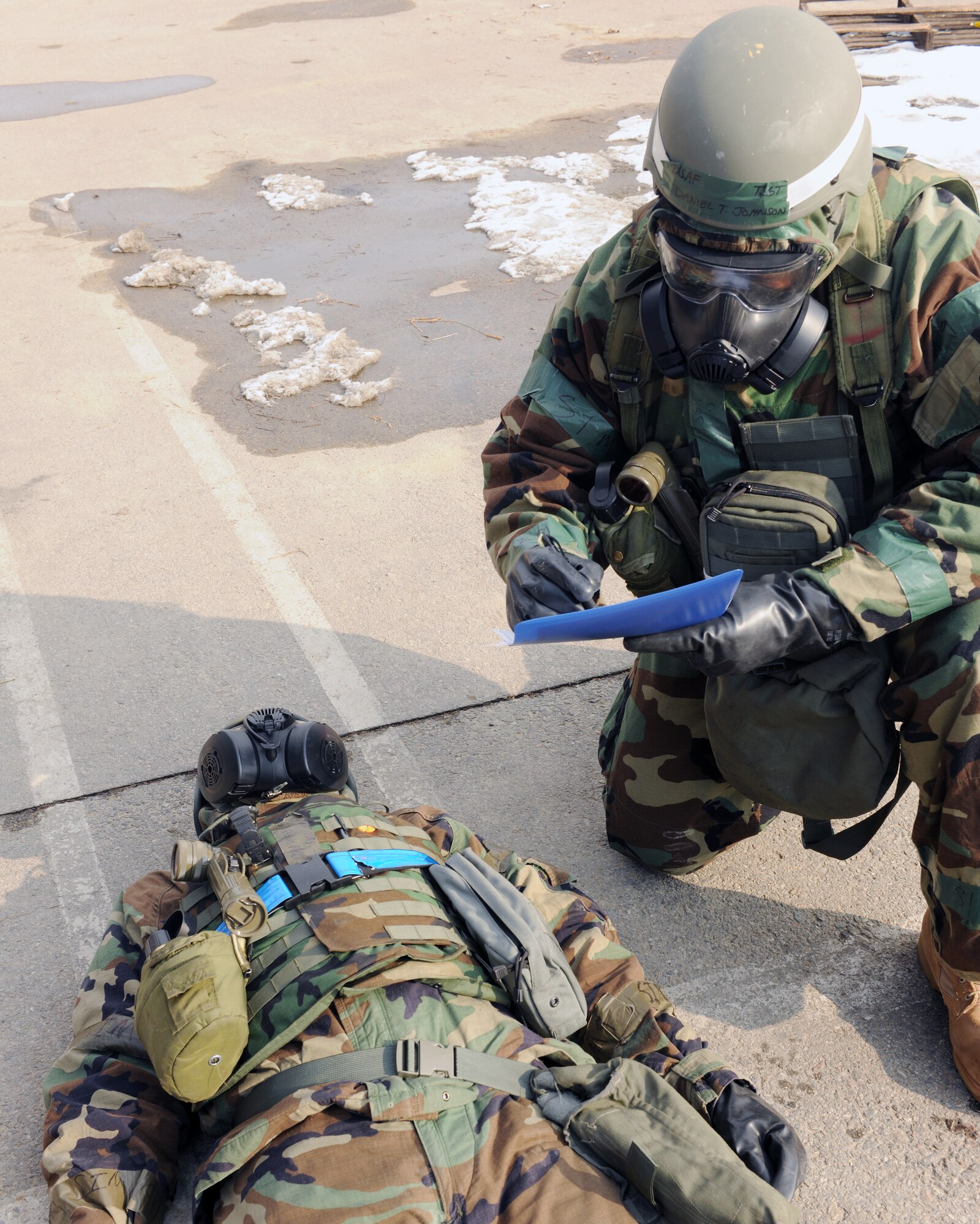KUNSAN AIR BASE, Republic of Korea -- Tech. Sgt. Daniel Johnson, 8th Medical Support Squadron, checks a patient for contamination here Jan. 25 during the peninsula-wide exercise Beverly Bulldog 11-01. Wolf Pack Airmen are currently participating in the exercise to prepare for the 8th Fighter Wing's Operational Readiness Inspection. (U.S. Air Force photo/Senior Airman Ciara Wymbs) 