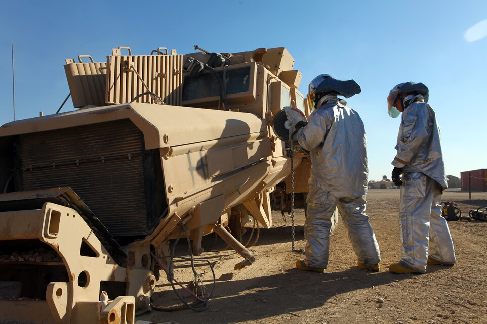 Crash, Fire and Rescue Marines with Marine Wing Support Squadron 373, 3rd Marine Aircraft Wing (Forward), practice rescue procedures on an up-armored vehicle aboard Camp Leatherneck, Afghanistan, Jan. 25.  The Marines, assigned to the Tactical Response Team, train on unserviceable vehicles to prepare for real-life scenarios and receive hands-on experience with their equipment.