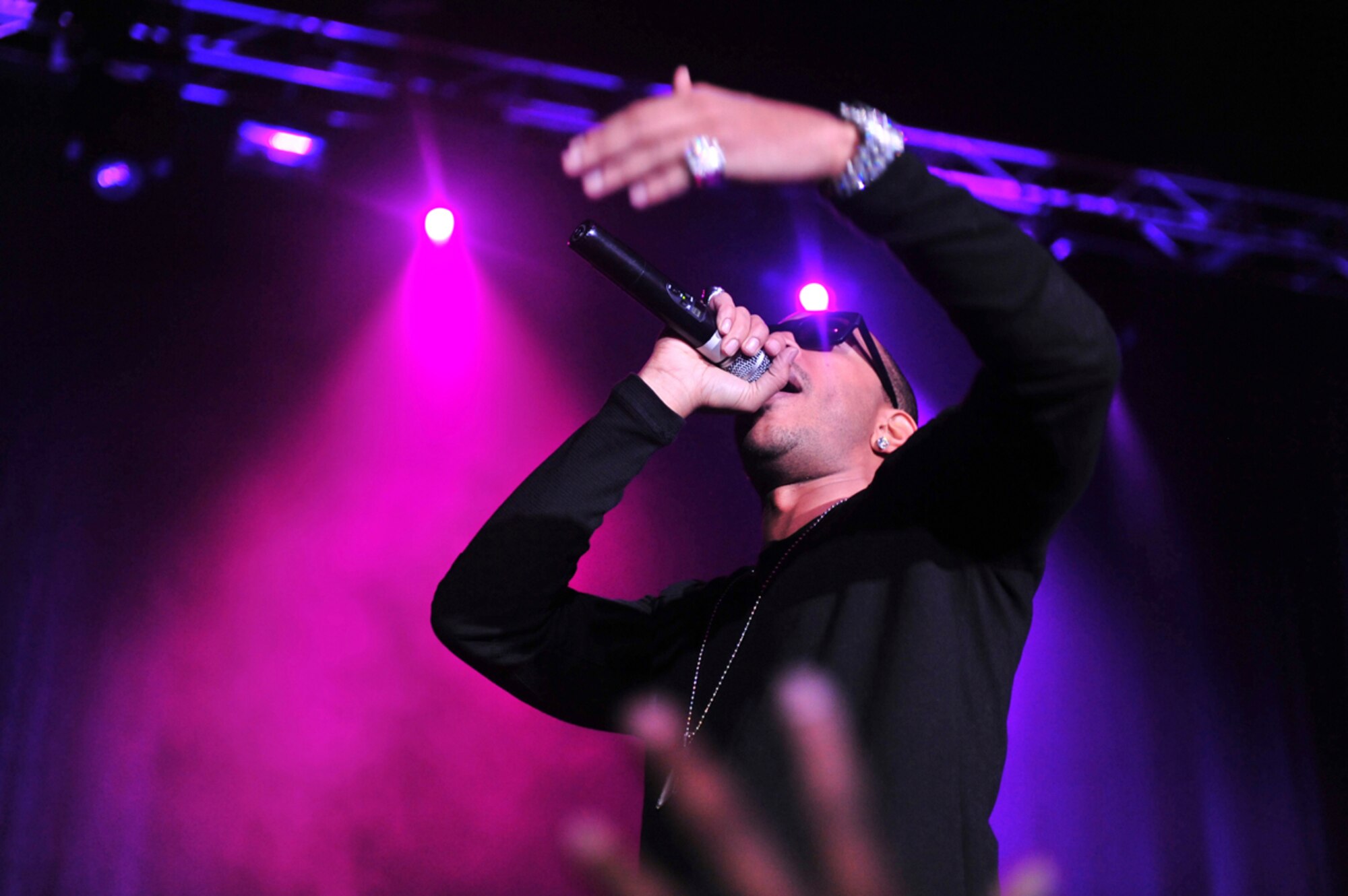 ANCHORAGE, Alaska -- A fan reaches for  Chris "Ludacris" Bridges as he performs at the Sullivan Arena, Jan. 20. Around 2,000 tickets for the concert were given to service members and their families from the Air Force Reserve. (U.S. Air Force Photo by Senior Airman Kristin High)