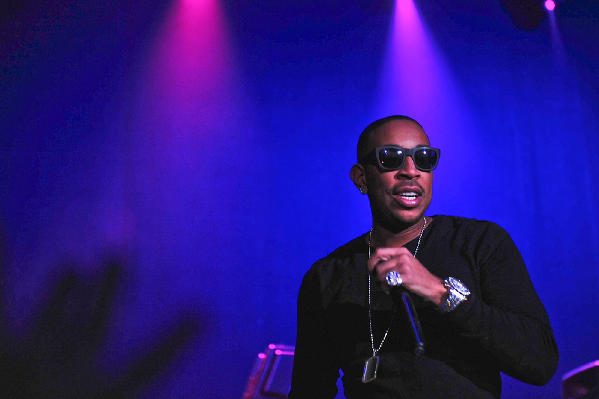 ANCHORAGE, Alaska -- Fans reach for Chris "Ludacris" Bridges as he performs at the Sullivan Arena, Jan. 20. Around 2000 tickets for the concert were given to service members and their families from the Air Force Reserve. (U.S. Air Force Photo by Senior Airman Kristin High)