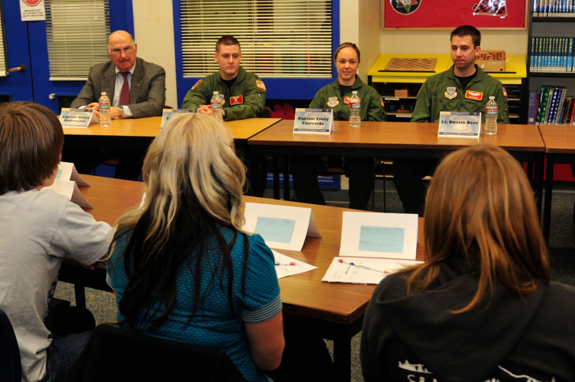 Capt. Patrick Ris, left, Capt. Emily Yturralde, center, and Capt. Dustin Dere, all assigned to McChord Field’s 10th Airlift Squadron, speak to seventh and eighth graders at Key Peninsula Middle School’s annual pilot panel Jan. 24 in Lakebay, Wash. The students asked the pilots questions such as, “Did you always want to be a pilot?” and “Do you enjoy traveling all over the world?” (U.S. Air Force photo/Airman Leah Young)