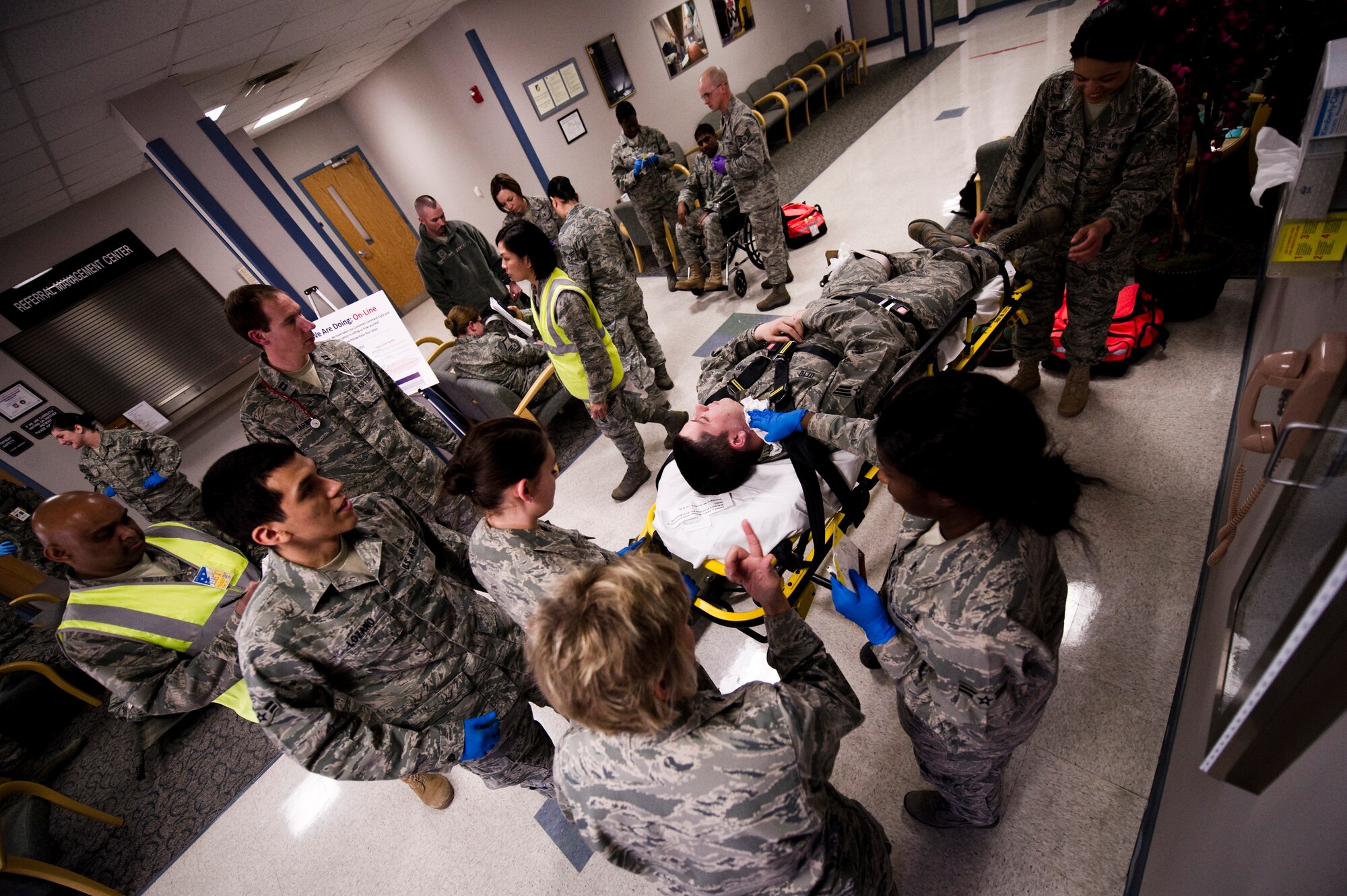 HOLLOMAN AIR FORCE BASE, N.M. -- Senior Airman J Otto, 49th Medical Operations Squadron, receives medical attention in the Medical Clinic during an exercise Jan. 22, 2011. This lobby in the clinic was used for triaging patients to determine the degree of care they needed. The degree of care would be the determining factor of what facility they would be transferred to. The primary objectives evaluated during this exercise were the 49th Mental Health Flight's capability to deal with sudden violence and how follow-on actions were handled between the 49th Security Forces Squadron and 49th Medical Group. (U.S. Air Force photo by Airman 1st Class Joshua Turner/Released)