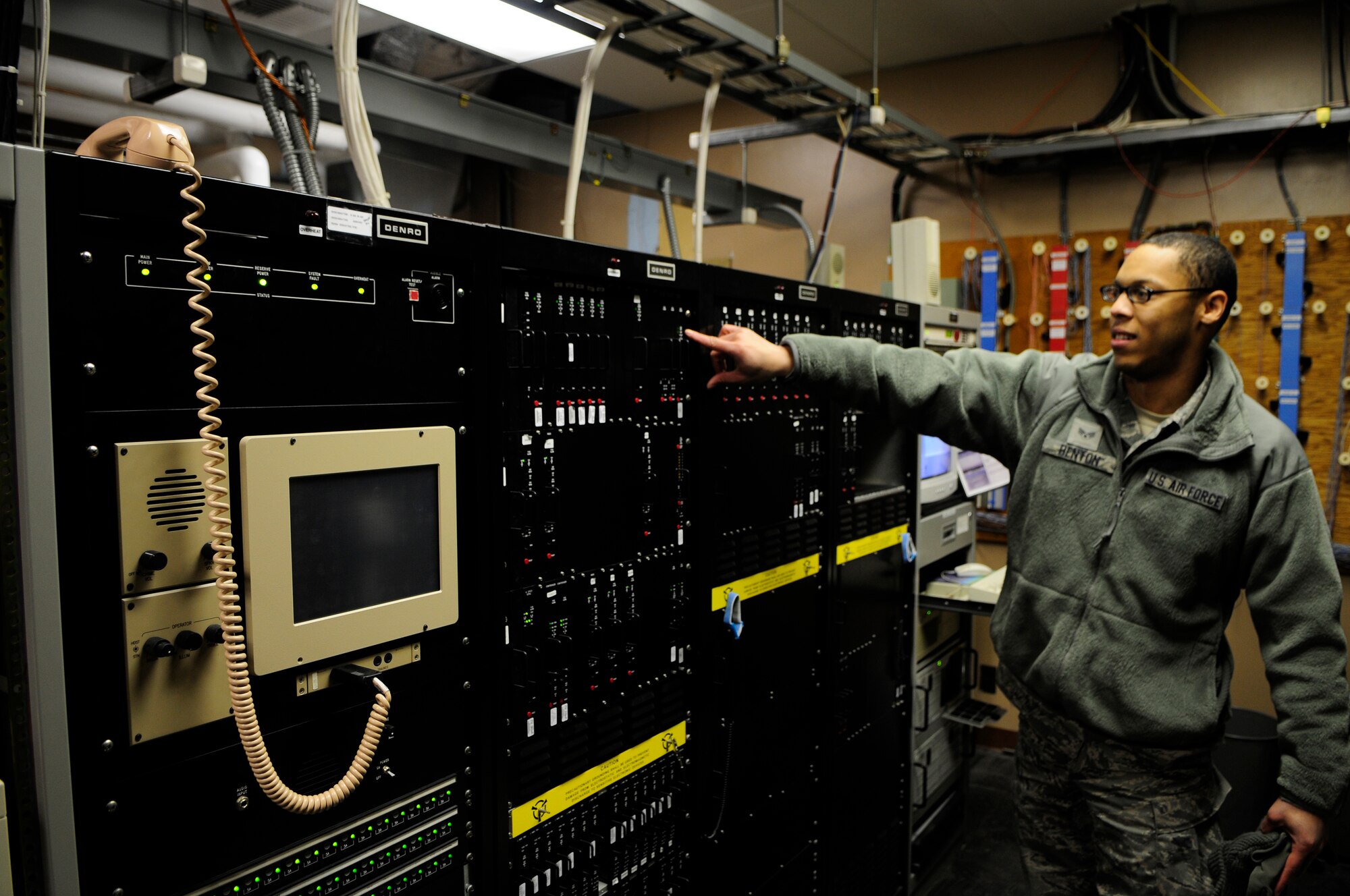 Senior Airman Cory Benton tests an enhanced terminal voice system switch Jan. 19, 2011, Eielson Air Force Base, Alaska.  The system supports Eielson's communications hub with several abilities including transmiting safety alerts to the entire base if necessary.  Airman Benton is assigned to the 354th Communications Squadron as an airfield sytems technician.  (Air Force photo by/Airman 1st Class Yash Rojas)