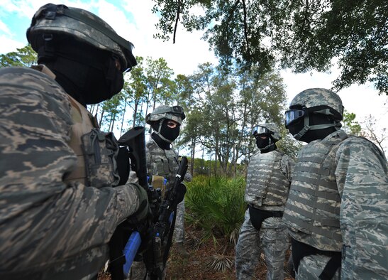 CAMP BLANDING, Fla. -- Gen. William M. Fraser III, commander of Air Combat Command, (front right) speaks with two Air Force members about the ground combat training course before going through the training with them at Camp Blanding, Fla., Jan. 24. (U.S. Air Force photo/Airman 1st Class Joshua Green) 
