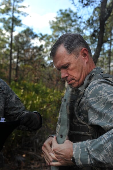 CAMP BLANDING, Fla. -- Gen. William M. Fraser III, commander of Air Combat Command, puts on a flak vest while preparing to participate in a ground combat training course Jan. 24. General Fraser visited Camp Blanding to get a first-hand look at the qualification training course for battlefield weather Airmen. (U.S. Air Force photo/Airman 1st Class Joshua Green)
