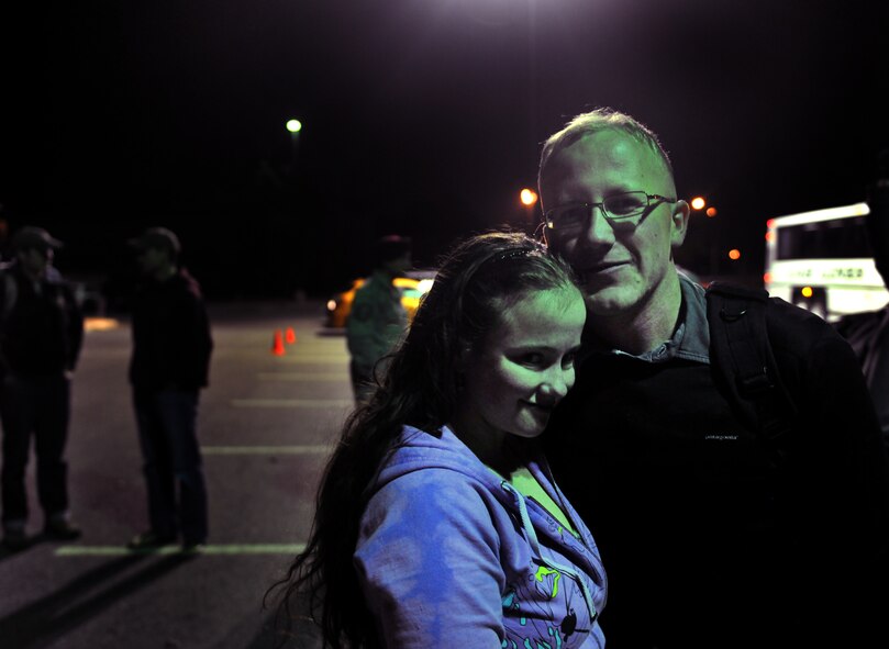 MOODY AIR FORCE BASE, Ga.-- Airman 1st Class Brigitte Brantley-Sisk, 23rd Wing Public Affairs journalist and Staff Sgt. Clifford Sisk, 38th Rescue Squadron aircrew flight equipment NCO, husband and wife, are finally reunited after five months of separation due to a deployment Jan. 12. (U.S. Air Force photo/Airman 1st Class Joshua Green)(RELEASED)
