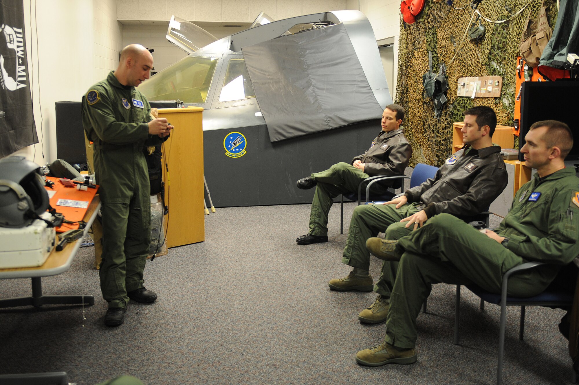 WHITEMAN AIR FORCE BASE, Mo. - Staff Sgt. Michael Garcia, 509th Operation Support Squadron survival evasion resistance escape specialist, instructs 509th Bomb Wing aircrew on proper care and use for survival equipment. (U.S. Air Force photo by Staff Sgt. Jason Huddleston) (Released)
