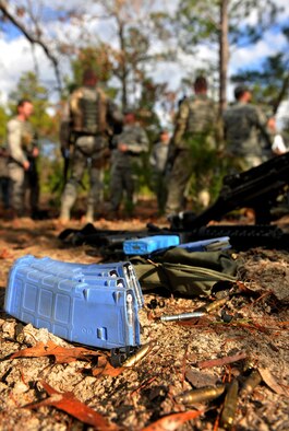 CAMP BLANDING, Fla. -- A clip from an M-16 machine gun filled with paint bullets lays on the ground after a ground combat course training session at Camp Blanding, Fla., Jan. 24. The training is conducted by U.S. Army personnel who teach their tactics to Air Force members who will be tasked to deploy with Army units. (U.S. Air Force photo/Airman 1st Class Joshua Green)
