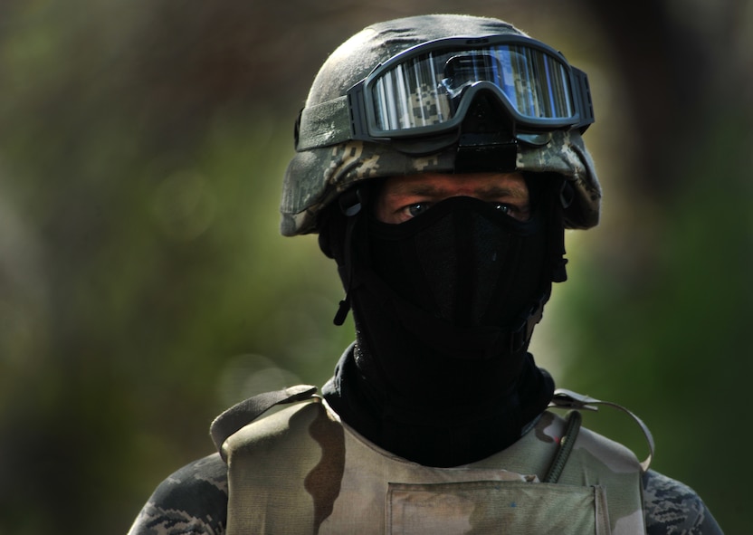 CAMP BLANDING, Fla.-- Maj. Ken Burton, 18th Weather Squadron director of operations at Fort Bragg, N.C., looks toward the ground combat training course before participating Jan. 24. (U.S. Air Force photo/Airman 1st Class Joshua Green)(RELEASED)
