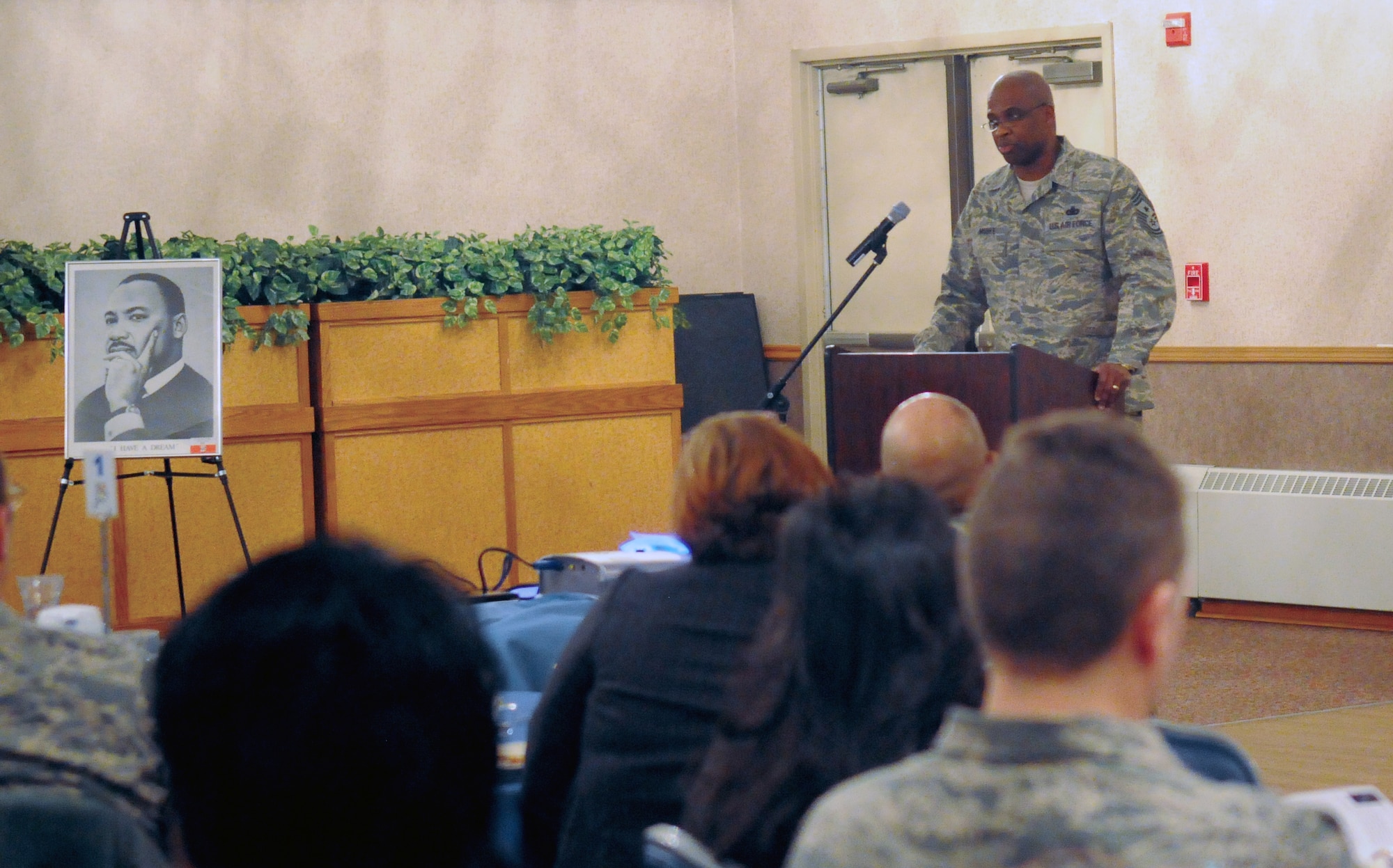 Chief Master Sgt. Jerry Moore speaks at the Martin Luther King Day Breakfast Jan. 20, 2011, Eielson Air Force Base, Alaska. Chief Moore's speech gave little known facts about Martin Luther King in the form of "Did you know..." Command Chief Moore is the 354th Fighter Wing Command Chief. (U.S. Air Force Photo by/ Airman 1st Class Janine Thibault)