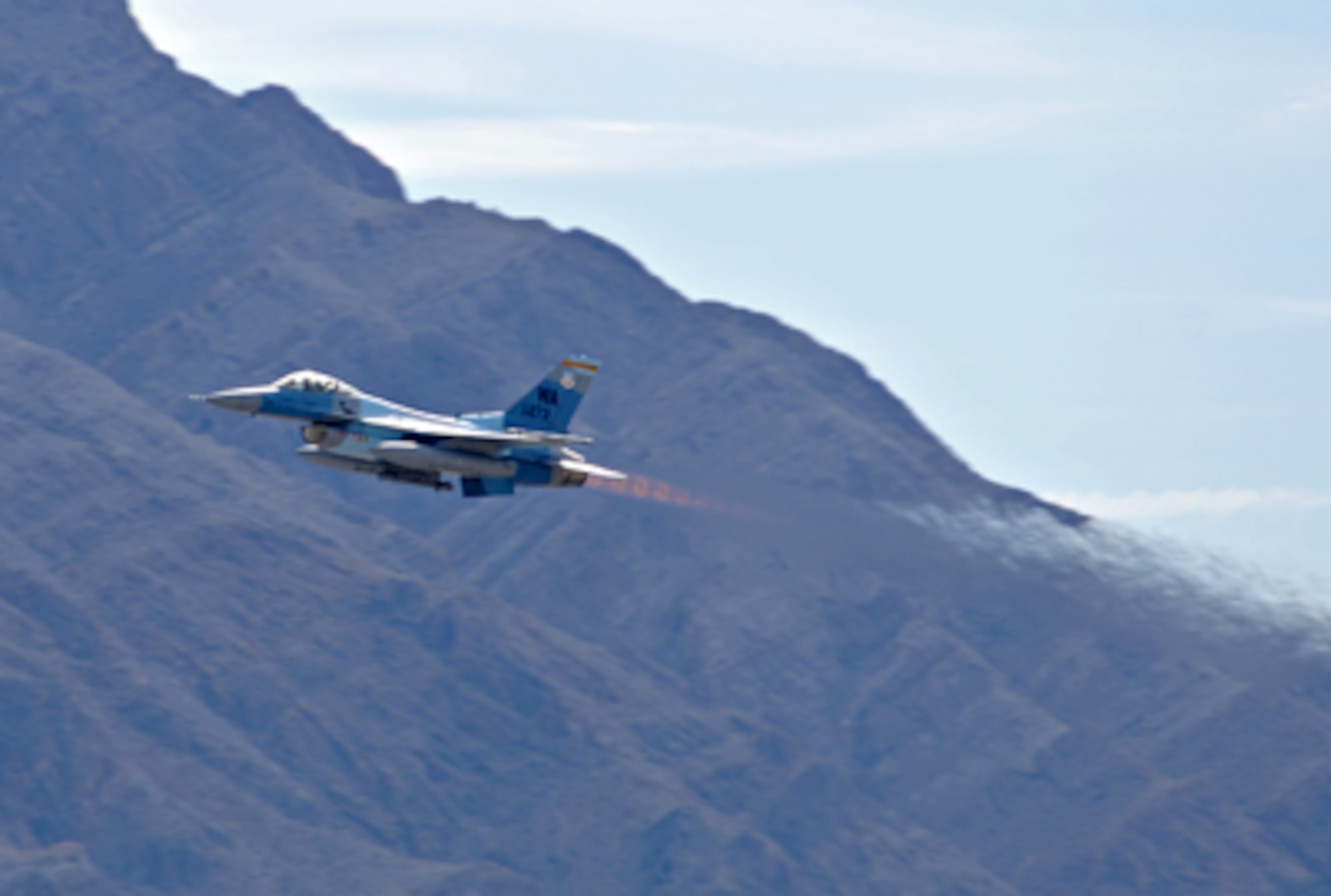 An F-16 Fighting Falcon from the 64th Aggressor Squadron, Nellis Air Force Base, Nev., takes off from the flightline during the first day of Red Flag 11-2 Jan. 24, 2011, at Nellis AFB. Red Flag is a combined exercise that provides a realistic, combat-training environment to the U.S. and its allies. (U.S. Air Force photo/Staff Sgt. Benjamin Wilson) 