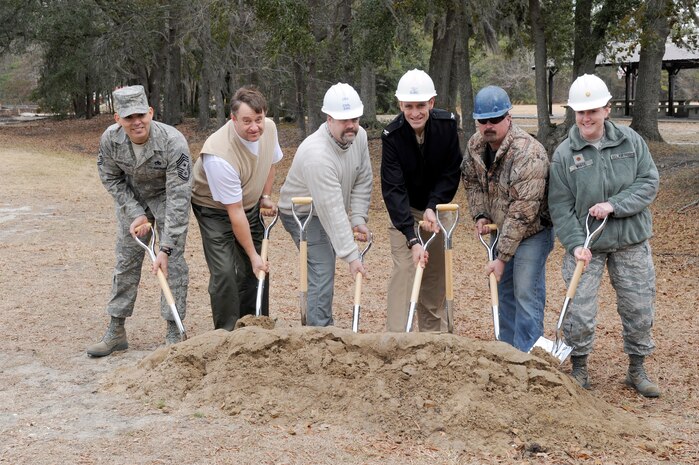 left to right: U.S. Air Force Chief Master Sgt. Jose LugoSantiago, Mr. Robert Hood, Mr. Todd Martin, U. S. Navy Capt. Ralph Ward, Mr. Rob Farcloth and Maj. Tara White prepare to break ground during the ground breaking ceremony for the Outdoor Recreation Center family campground Jan 26, 2011 at Joint Base Charleston-Air Base. This ground breaking is an upgrade to a community facility that will be able to accommodate 45 recreational vehicles and campers as opposed to the current campground that can only accommodate 17 RV's and campers. Chief LugoSantiago is the 628th Air Base Wing command chief, Mr. Hood is assigned to the 628th Contracting Squadron as the chief of construction flight, Mr. Martin is assigned to the 628th Civil Engineer Squadron, Captain Ward is the Joint Base Charleston deputy commander, Mr. Farcloth is a contractor with Lake Moultrie Construction and Major White is the 628th Force Support Squadron commander. (U.S. Air Force photo/Staff Sgt. Marie Brown)