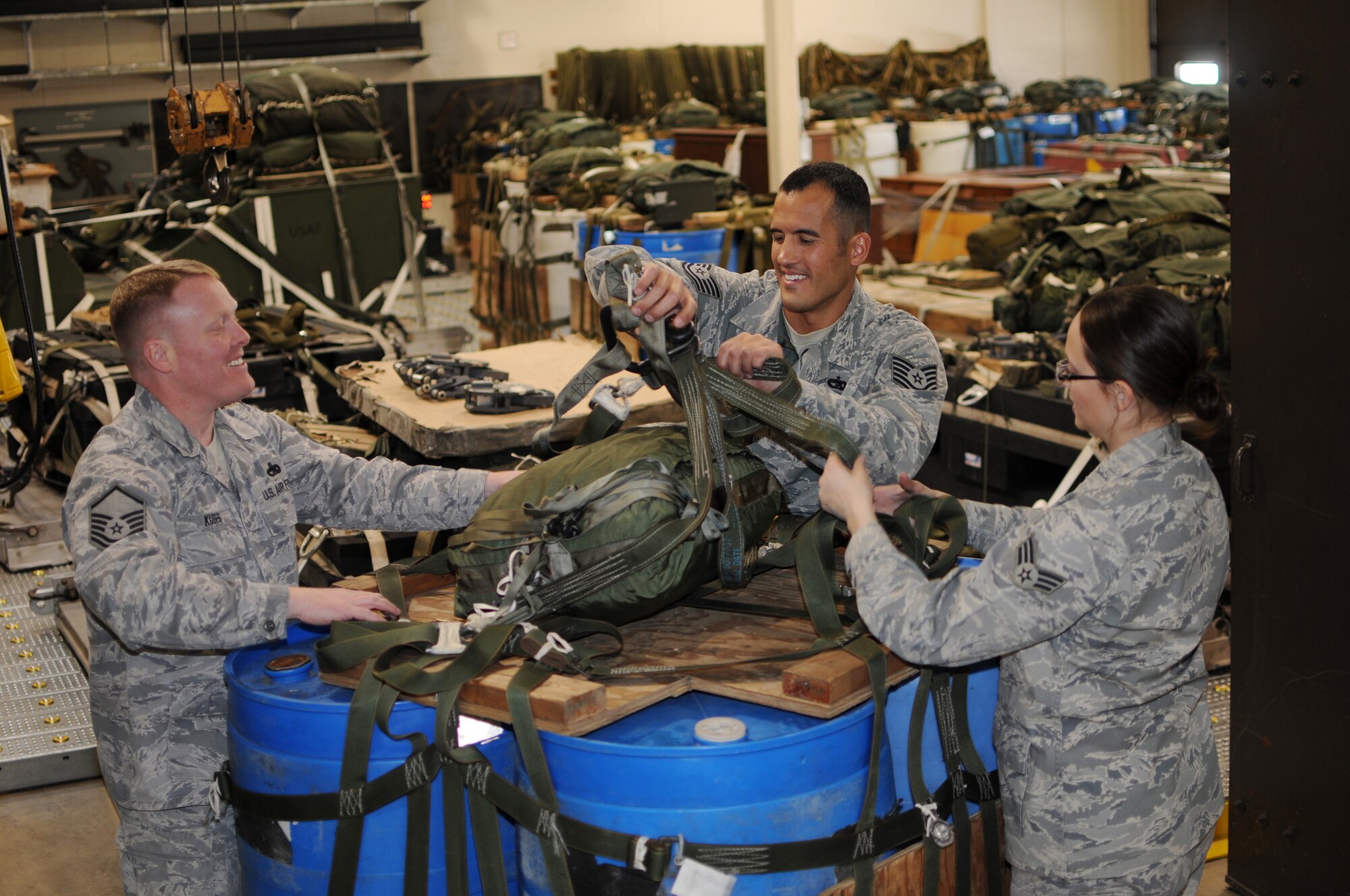 Master Sgt. John Kubes, superintendent of the small air terminal at the 133rd Logistics Readiness Squadron, (left) Tech. Sgt. Jacob Norsten, (center) and Senior Airman Kathryn Morrill, also of of the small air terminal, rig a pallet on Jan. 22, 2010 on the Air National Guard Base in St. Paul, Minn. Kubes has been selected to represent Minnesota as the Air Guard Outstanding Senior NCO, Norsten has been selected to represent Minnesota as the Air Guard Outstanding NCO and Morrill has been selected to represent Minnesota as the Air Guard Outstanding Airman for 2011. USAF official photo by Tech. Sgt. John Wiggins