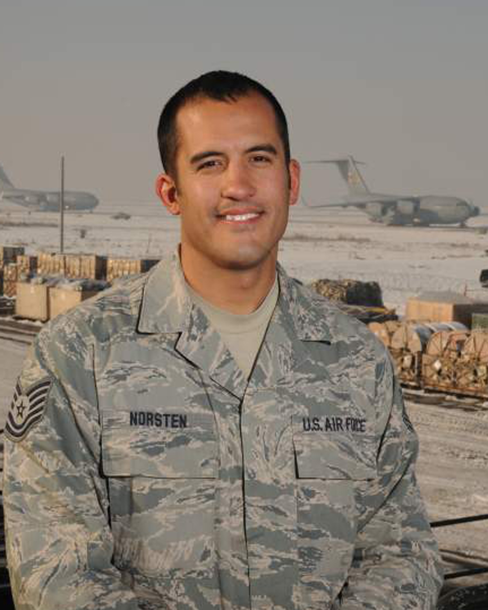 Tech. Sgt. Jacob Norsten of the small air terminal at the 133rd Logistics Readiness Squadron pauses near the flightline of a deployed location in November 2010 where he was working loading aircraft in support of Operation Enduring Freedom and Operation New Dawn. Norsten has been selected to represent Minnesota as the Air Guard Outstanding NCO for 2011.