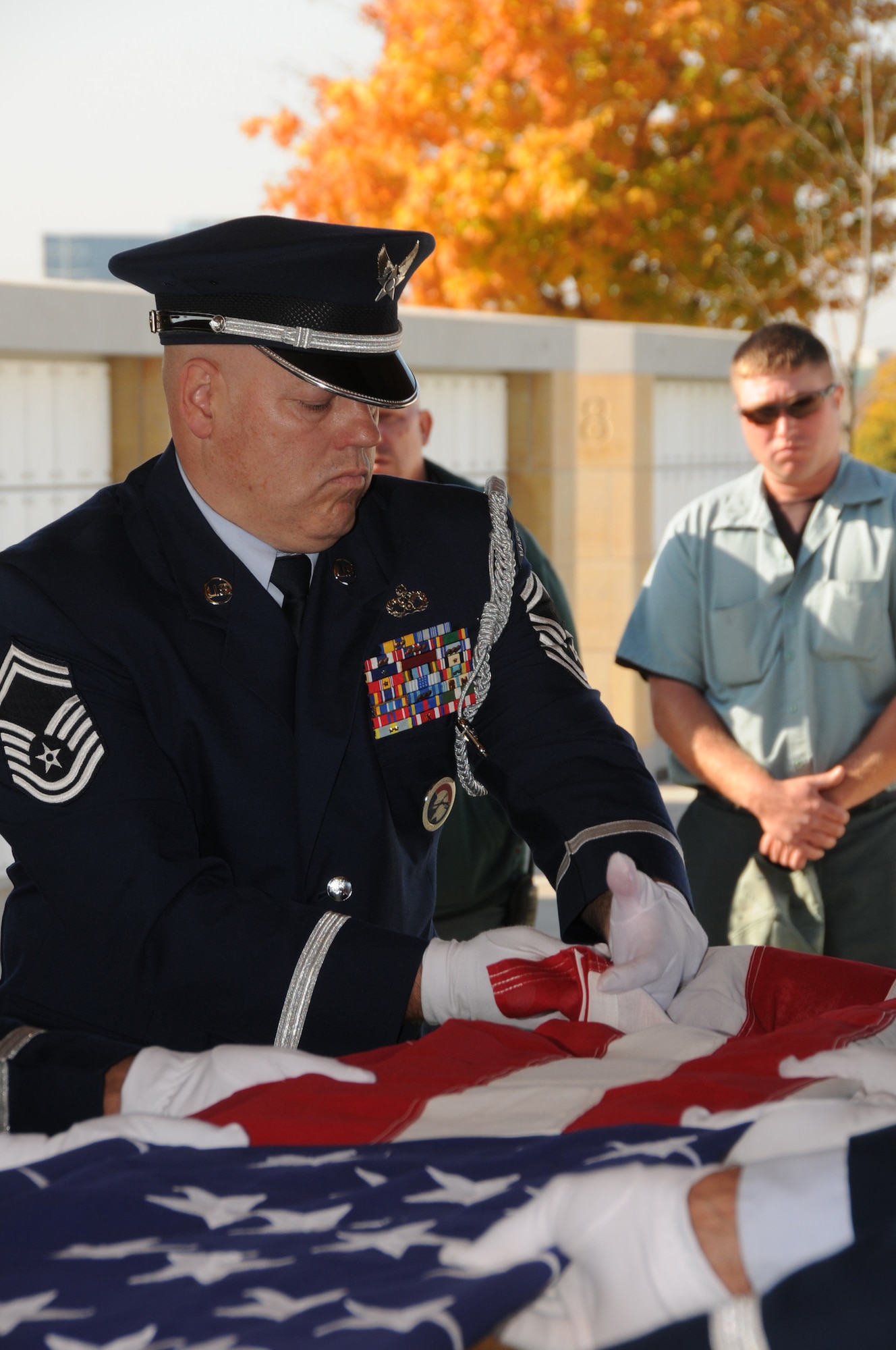 Senior Master Sgt. Dave Gonsoski, superintendant of the power production shop at the 133rd Civil Engineer Squadron, folds a flag over the remains of a fallen Airman during a funeral at the Fort Snelling Cemetery in Minneapolis, Minn. on Oct 12, 2010. Gonsoski has been selected to represent Minnesota as the Air Guard Outstanding Honor Guard member for 2011. USAF official photo by Senior Master Sgt. Mark Moss