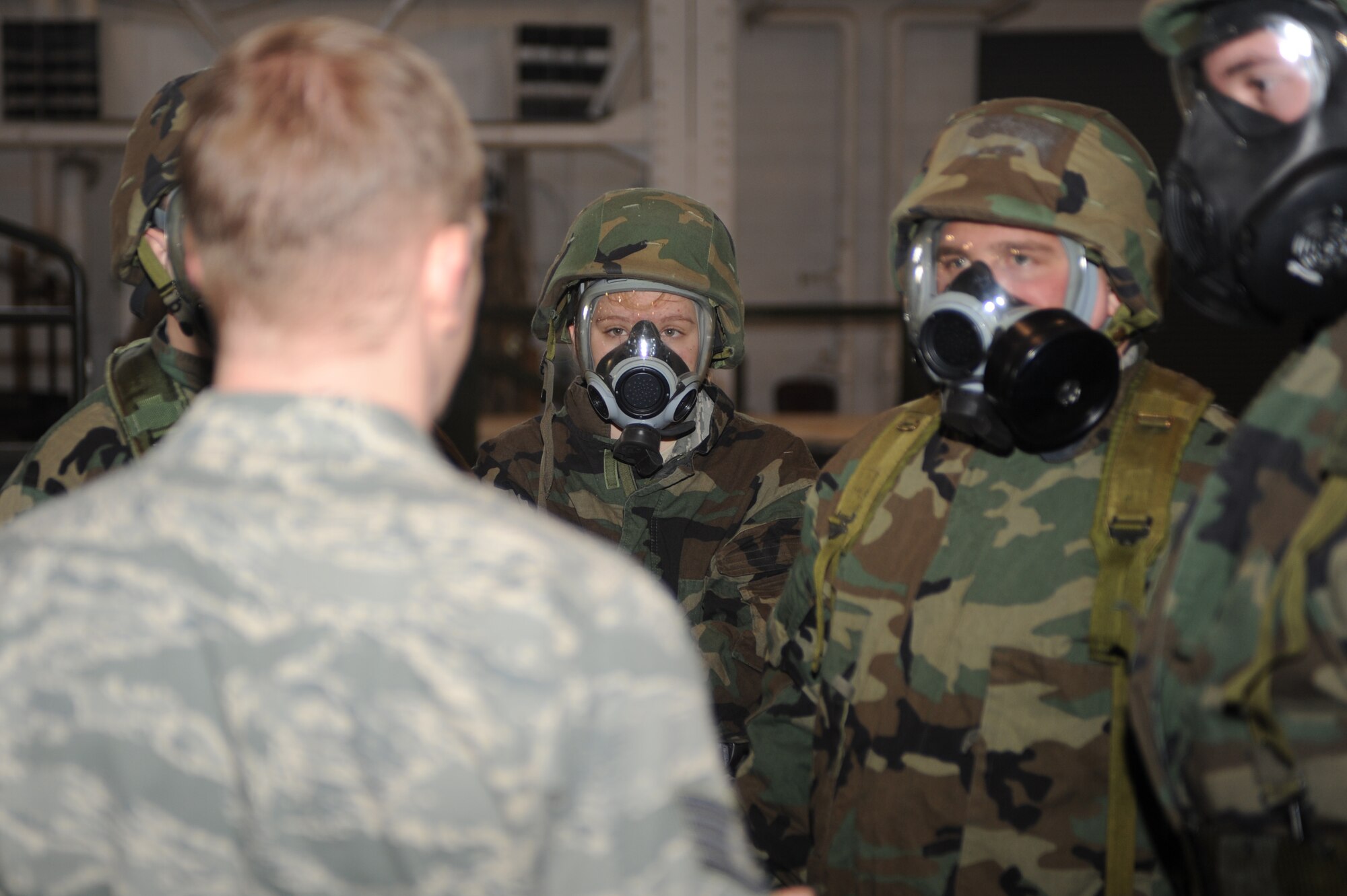 MINOT AIR FORCE BASE, N.D. – Airmen are briefed on how to use Mission Oriented Protective Posture gear during the Ability to Survive and Operate training here Jan. 19.  During ATSO training, Airmen learn the basics of detaining enemies, self aid buddy care, different types of explosives, how to respond to a chemical attack and more. (U.S. Air Force photo/ Airman 1st Class Aaron- Forrest Wainwright)