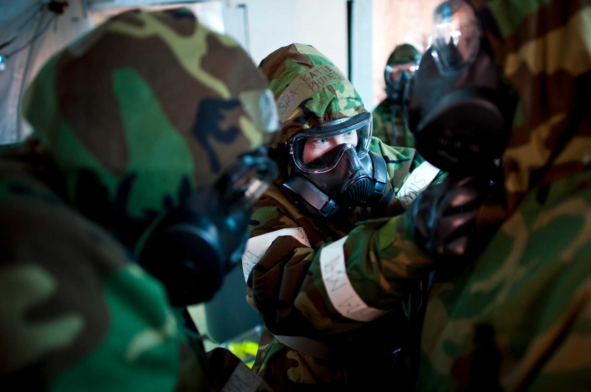 Senior Airman Katie Phines, 35th Dental Squadron, removes chemical protective gear from a patient during an operational readiness exercise at Misawa Air Base, Japan, Jan. 26, 2011. This exercise, Misawa’s first ORE of the year, is designed to test Airmen’s ability to survive and operate in a deployed environment. (U.S. Air Force photo by Staff Sgt. Samuel Morse/Released)