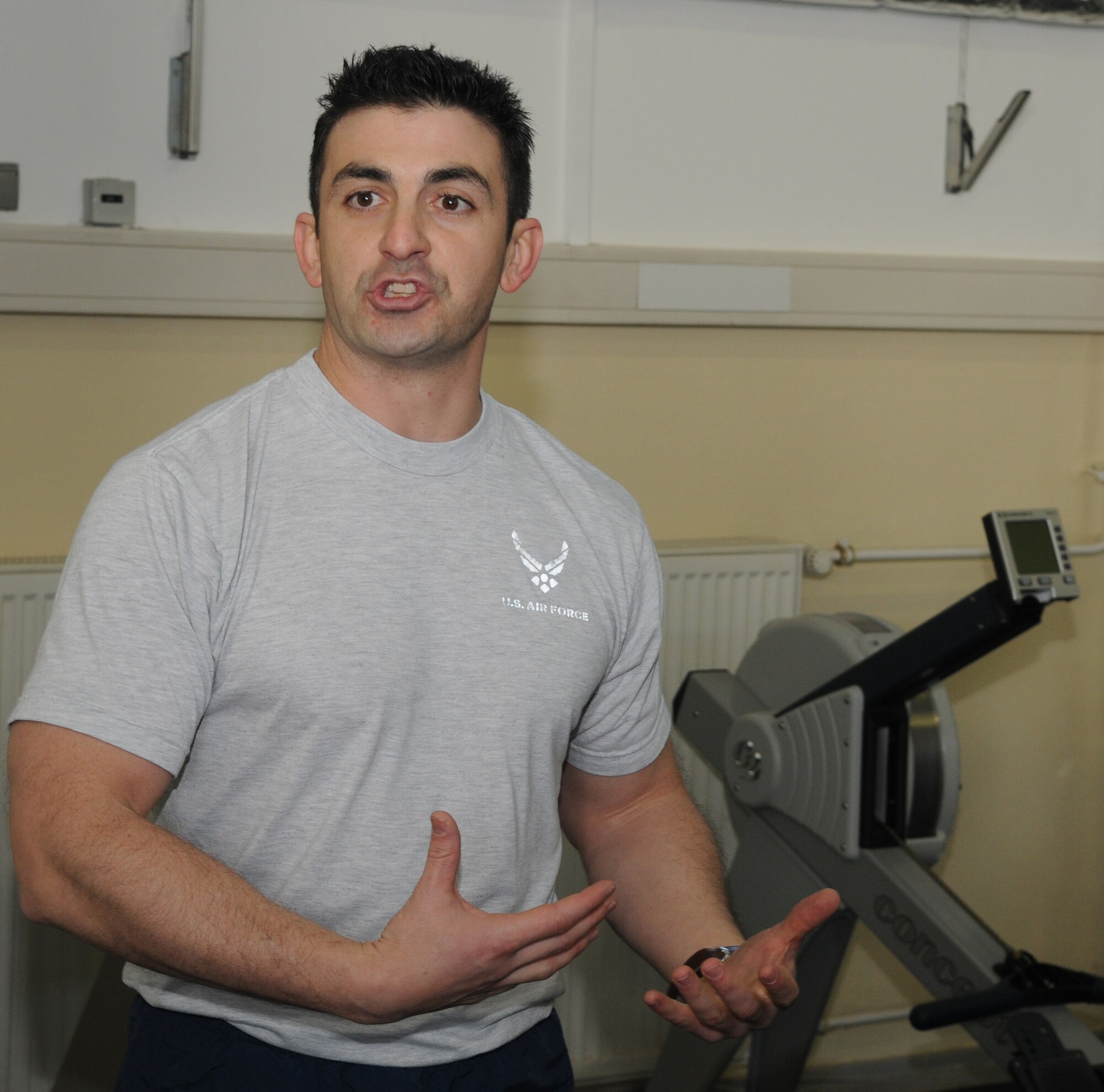 SPANGDAHLEM AIR BASE, Germany – Staff Sgt. Christopher Johnson, 52nd Communications Squadron physical training leader and CrossFit fitness specialist, speaks about the cross-fit program during the grand opening of the 52nd Force Support Squadron’s combat fitness facility here Jan. 21. The new combat fitness facility will open to squadrons for individual and unit physical training in February. Trained physical training leaders will incorporate CrossFit exercises into unit programs. (U.S. Air Force photo/Senior Airman Nick Wilson)