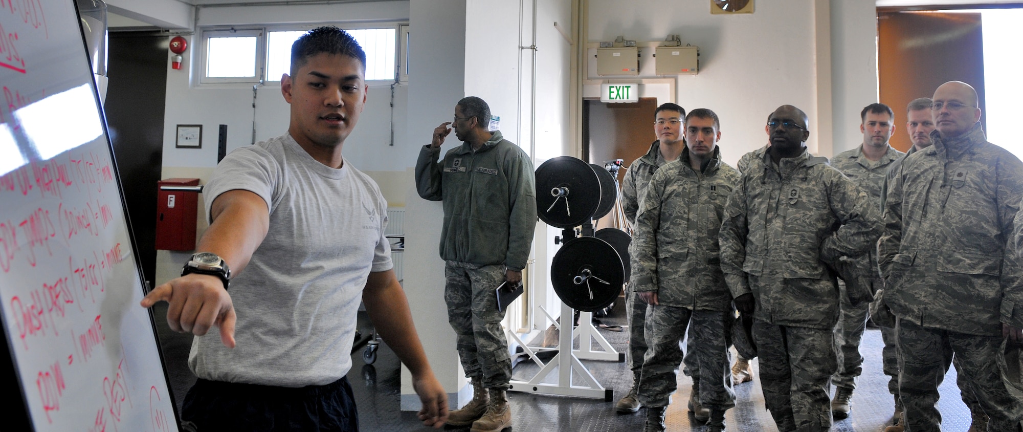 SPANGDAHLEM AIR BASE, Germany – Airman 1st Class Frank Balingit, 52nd Force Support Squadron combat fitness facility manager, discusses the new CrossFit program during the grand opening of the 52nd Force Support Squadron’s combat fitness facility here Jan. 21. The new combat fitness facility will open to squadrons for individual and unit physical training in February. Trained physical training leaders will incorporate CrossFit exercises into unit programs. (U.S. Air Force photo/Senior Airman Nick Wilson)