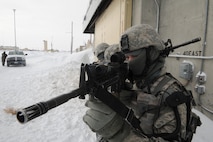 MINOT AIR FORCE BASE, N.D. -- Airman 1st Class Nathan Anderline, 5th Security Forces Squadron response force team member, lines up his sights during a training scenario at the weapons storage area here Jan. 24. Training like this helps the 5th SFS “Defenders” keep their combat skills sharp. (U.S. Air Force photo/Senior Airman Michael J. Veloz)
