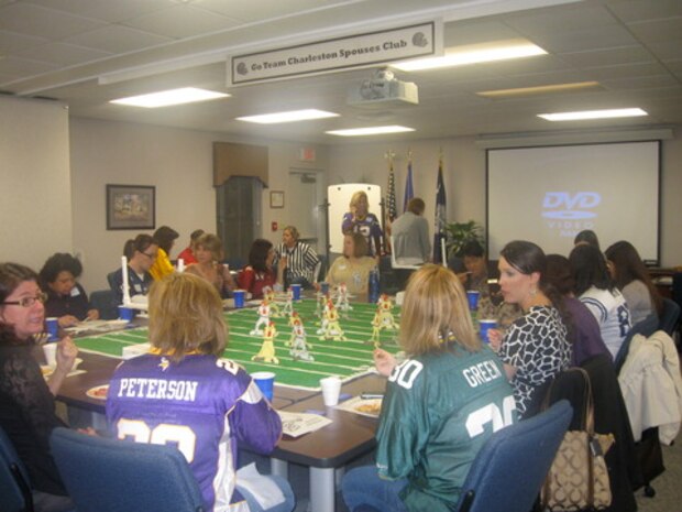 Team Charleston Spouses Club held their New Year's Kick-Off social at the Airman and Family Readiness Center on Joint Base Charleston – Air Base, Jan. 25. Attendees wore their favorite sports team jerseys as they kicked off a new year of services to military families. Many attendees brought slow-cooker dishes to the potluck dinner and shared their favorite recipes to kick off a future TCSC cookbook. Attendees also heard about the 11 active TCSC mini-clubs that will kick off shared recreational interests and help develop deeper friendships among spouses. In February, TCSC will host an off-base tea social and their annual Scholarship Auction, scheduled for Mar. 18, will be held at the Charleston Club. All Scholarship Auction proceeds will benefit dependents (children and spouses) who are furthering their education. TCSC is open to spouses of all payrades of active duty, Reserves and retired service members, spouses of deceased or missing service members and any civil service member associated with Joint Base Charleston. (photo courtesy of Teresa Givens)


