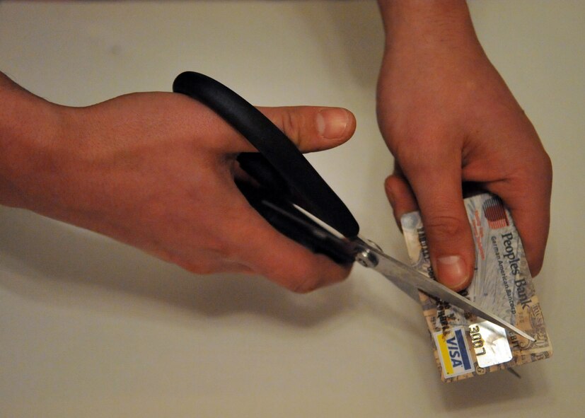 MINOT AIR FORCE BASE, N.D. – Air Force Global Strike Command and Team Minot Airmen are expected to keep their finances in order. Minot Airmen can increase their savings by cutting up a few of their credit cards. (U.S. Air Force photo/Airman 1st Class Jessica McConnell)