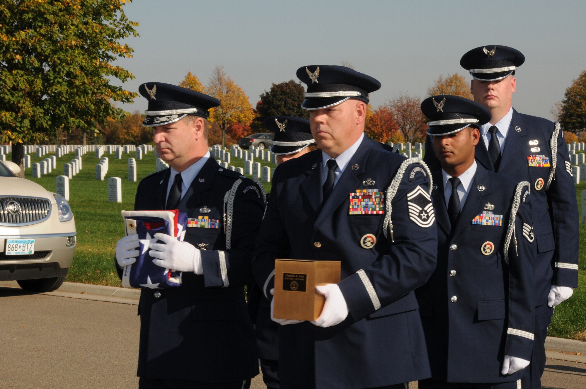 Senior Master Sgt. Dave Gonsoski (center) holds an urn with the ashes of a fallen Airman as the 133rd Airlift Wing Base Honor Guard marches in a funeral procession at Fort Snelling National Cemetery on Oct. 12, 2010. Gonsoski has been selected to represent Minnesota as the Air Guard Outstanding Honor Guard member for 2011.USAF official photo by Senior Master Sgt. Mark Moss