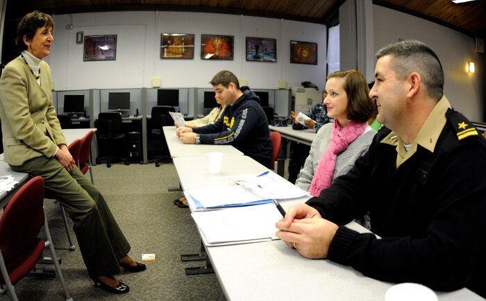 Navy Reservist Lt. j.g. Richard Hodgkiss listens to Kama Bentley, Fleet and Family Support Center's exceptional family member program specialist, as she presents essential information to members during an Individual Augmentee pre-deployment briefing at Joint Base Charleston - Weapons Station, Jan. 21. Lieutenant Hodgkiss and his wife attended the course in preparation for his upcoming deployment. The briefings are held to educate members and their families about the preparation process for an IA deployment. (U.S. Navy photo/Machinist's Mate 3rd Class Brannon Deugan)