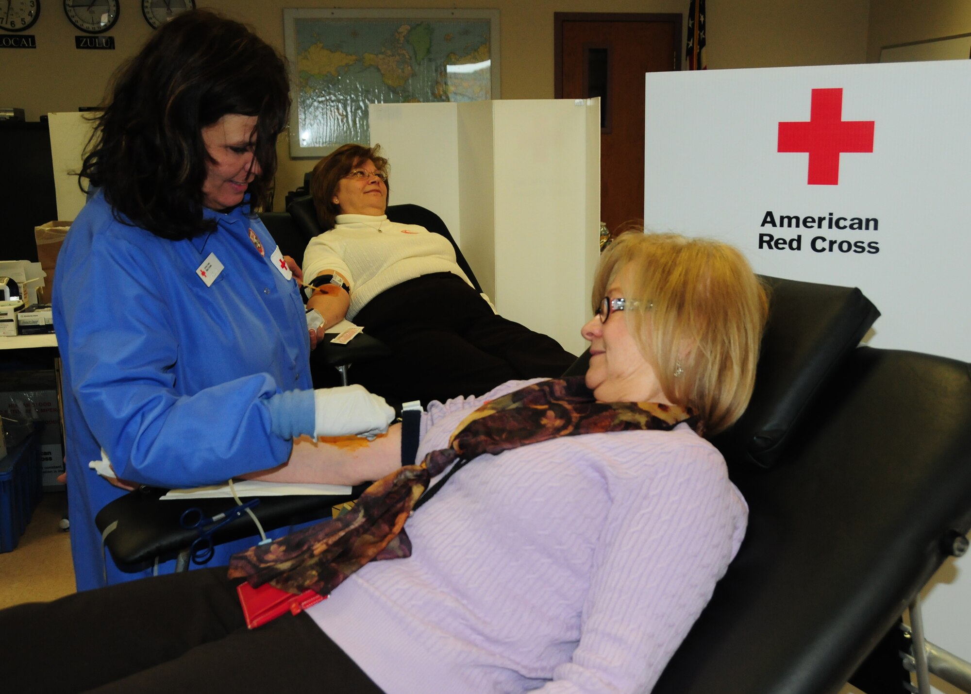 NIAGARA FALLS AIR RESERVE STATION, N.Y- Ms. Mary Ann Cooper, Contractor, SSI Logistics Manager was one of many base employees donating much needed blood during the American Red Cross blood drive which is held approximately every two months at the Niagara Air Base.  According to Ada Kowal Red Cross Team Supervisor, O negative is the most critical blood type but she urged that all blood types are needed (U.S. Air Force Reserve photo by Mr. Peter Borys)
