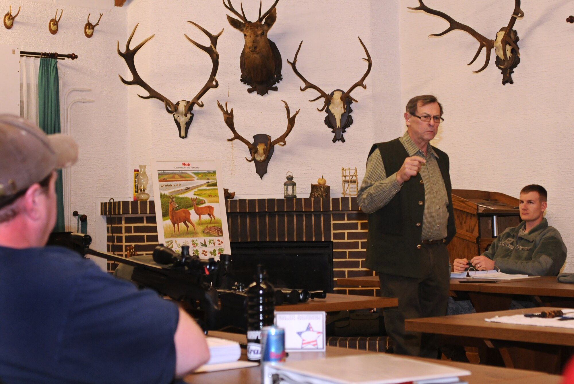 Retired U.S. Air Force Senior Master Sgt. Max Butler, German Hunting Course instructor, teaches weapon safety at the Rod and Gun Club, Vogelweh Military Complex, Germany, Jan. 25, 2011. The course teaches about German hunting laws, huntable animals, and animal conservation. (U.S. Air Force photo by Staff Sgt. Nathan Lipscomb)