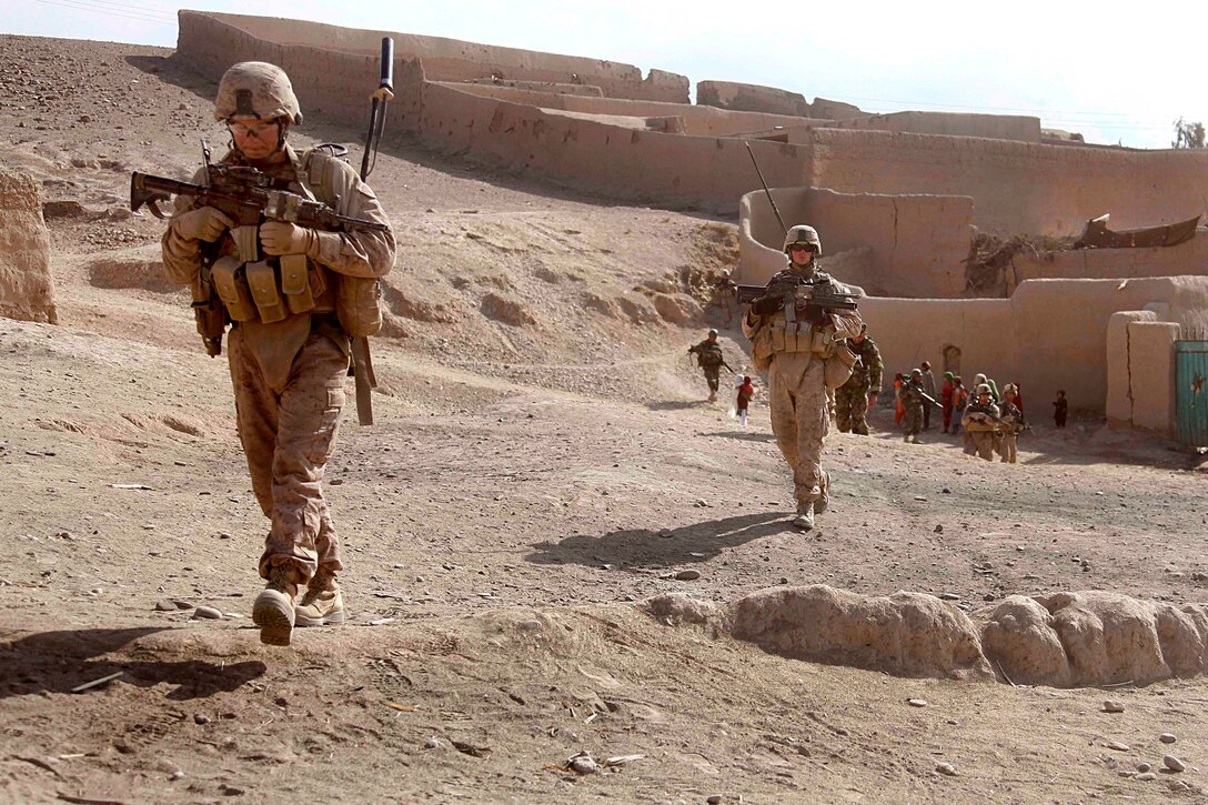 U.S. Marines and Afghan soldiers conduct a census patrol in the Sangin district of Helmand province, Afghanistan, Jan. 17, 2011.