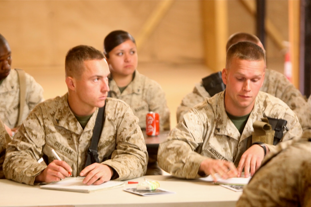 Marines with 1st Marine Logistics Group (Forward) take notes during the Lance Corporals Seminar at Camp Dwyer, Afghanistan, Jan. 26. The 3-day seminar aimed to teach the junior Marines the fundamentals of Marine Corps leadership in preparation for when they become noncommissioned officers.