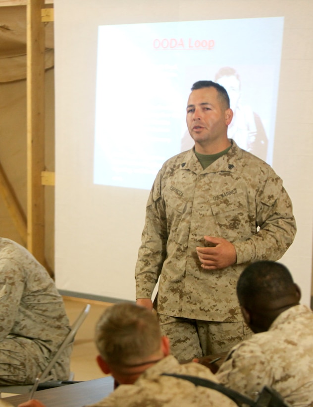 Sgt. Rodolfo A. Espinoza, heavy vehicle section leader and load master, Alpha Company, Combat Logistics Battalion 3, 1st Marine Logistics Group (Forward), gives a lecture on decision making to lance corporals during the Lance Corporals Seminar at Camp Dwyer, Afghanistan, Jan. 26. The 3-day seminar aimed to teach the junior Marines the fundamentals of Marine Corps leadership in preparation for when they become noncommissioned officers.